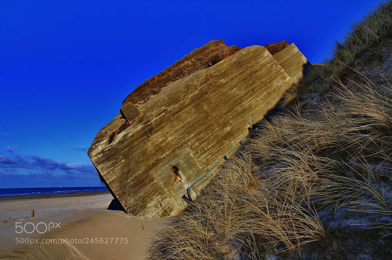 Canon EOS 60D sample photo. Tilting wwii bunker photography