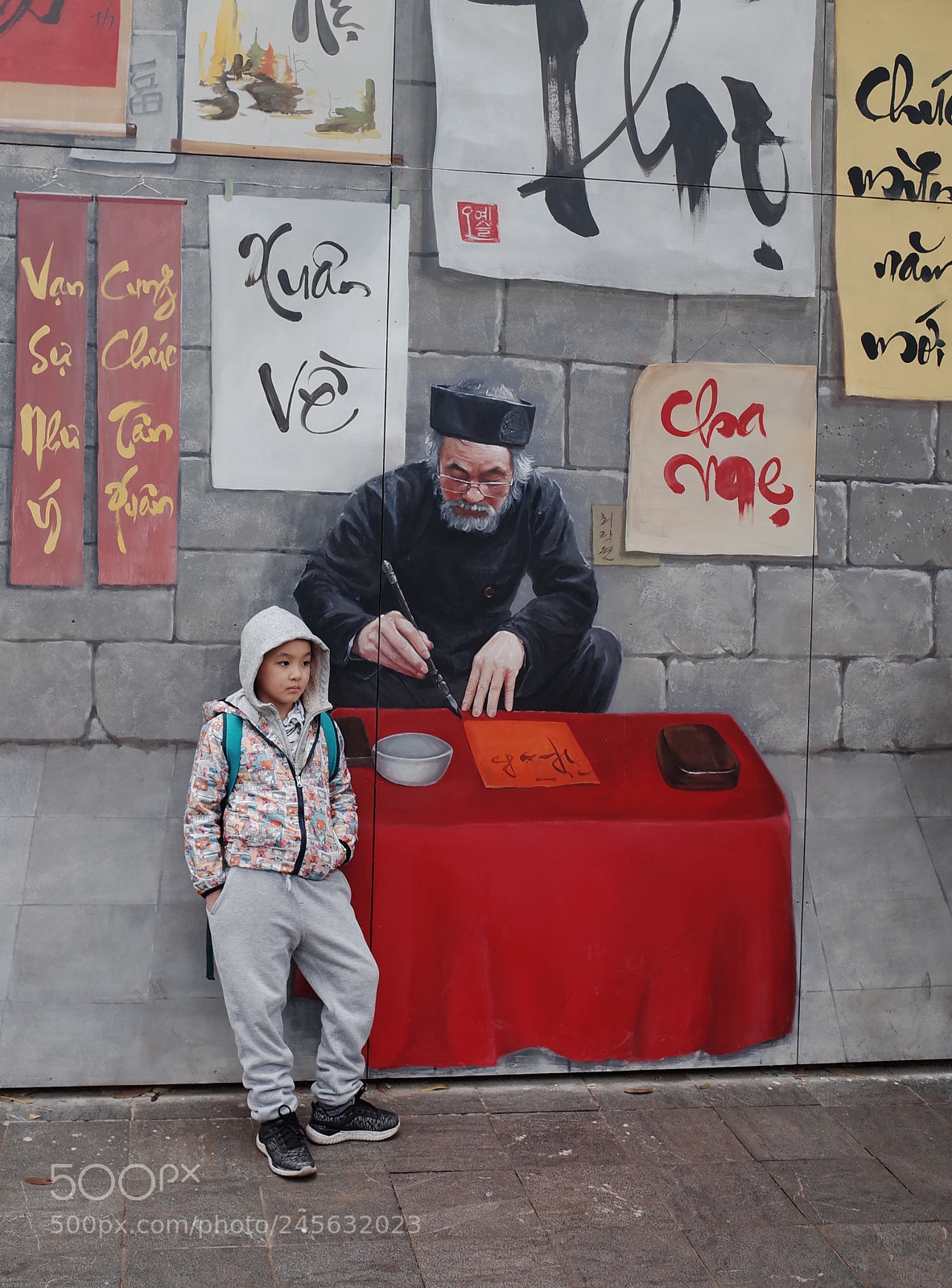 Ricoh GR II sample photo. Kid beside wall painting photography