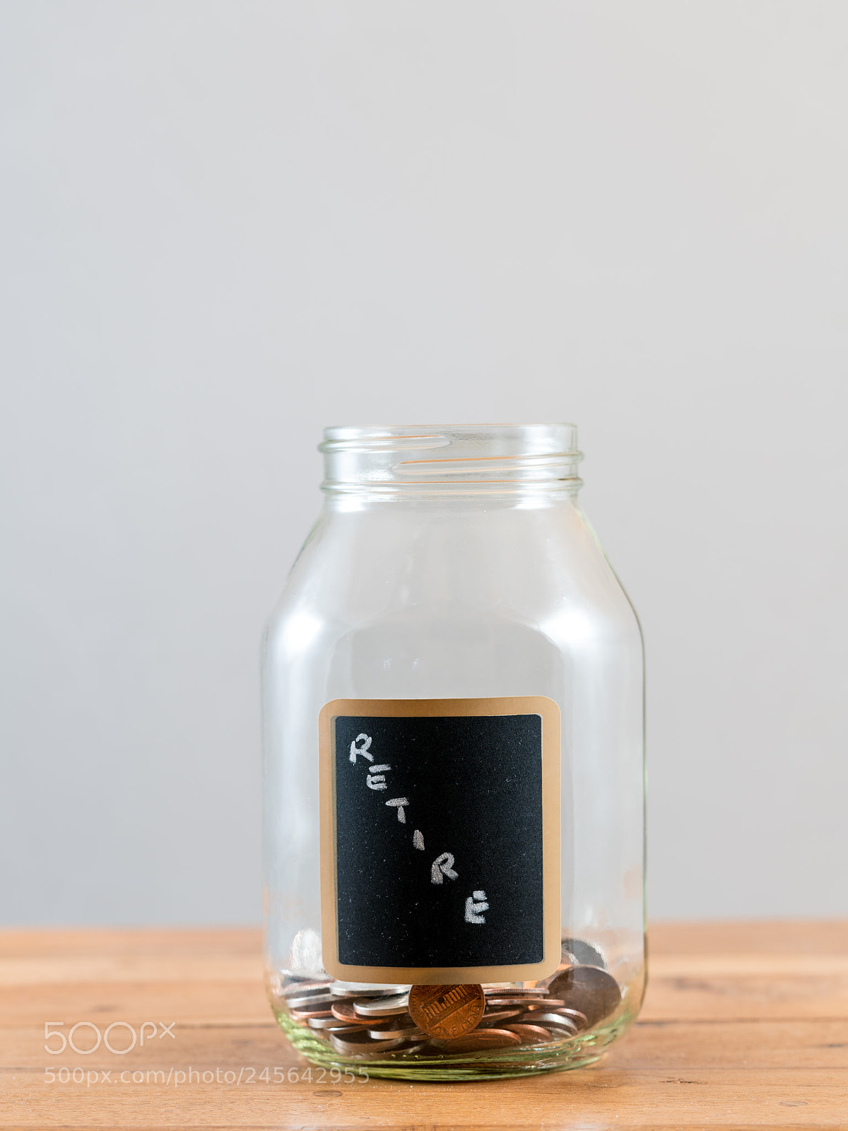 Sony a7R II sample photo. Loose change inside glass photography