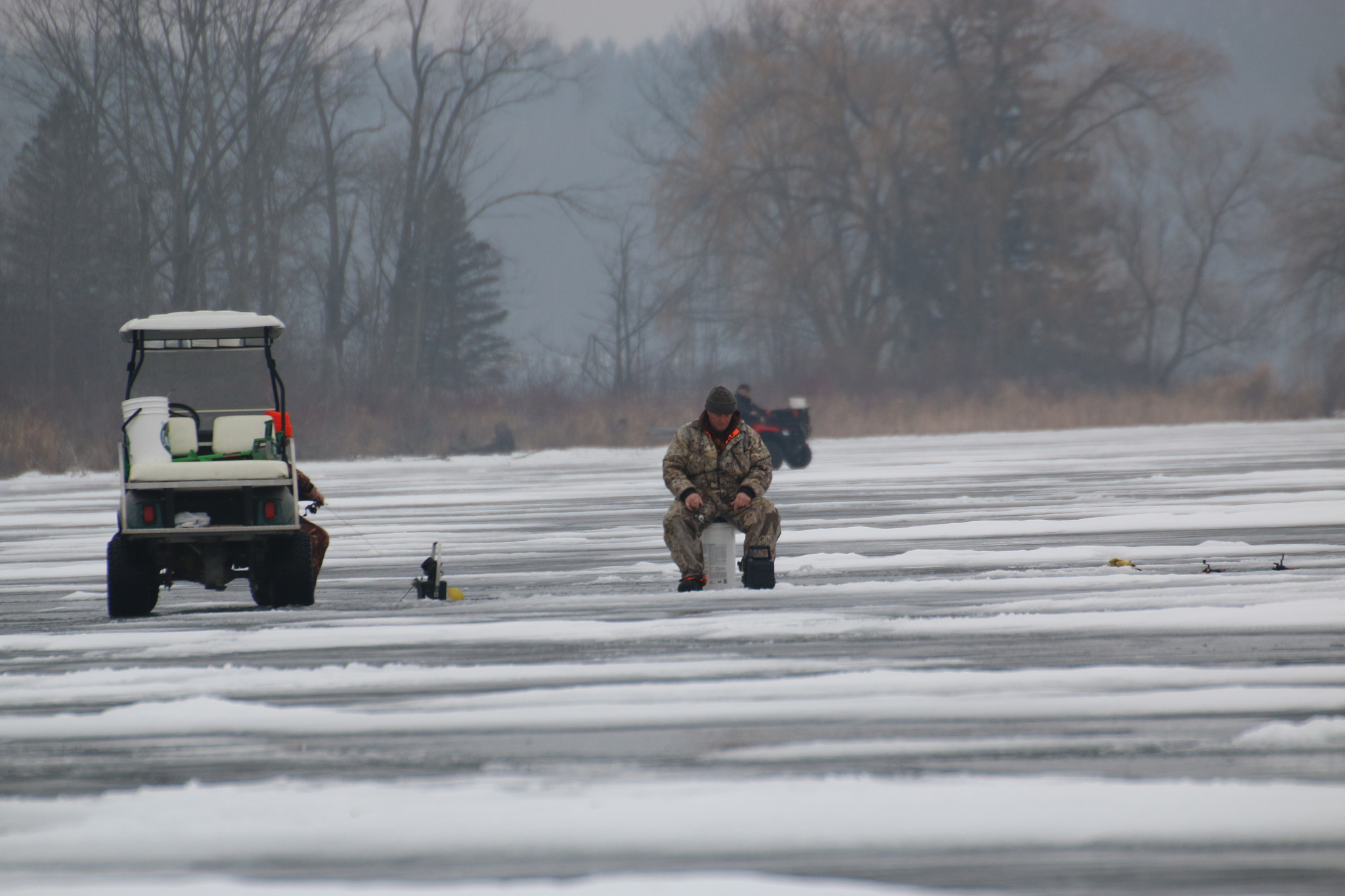 Canon EOS 70D + Sigma 50-500mm F4.5-6.3 DG OS HSM sample photo. Man ice fishing photography