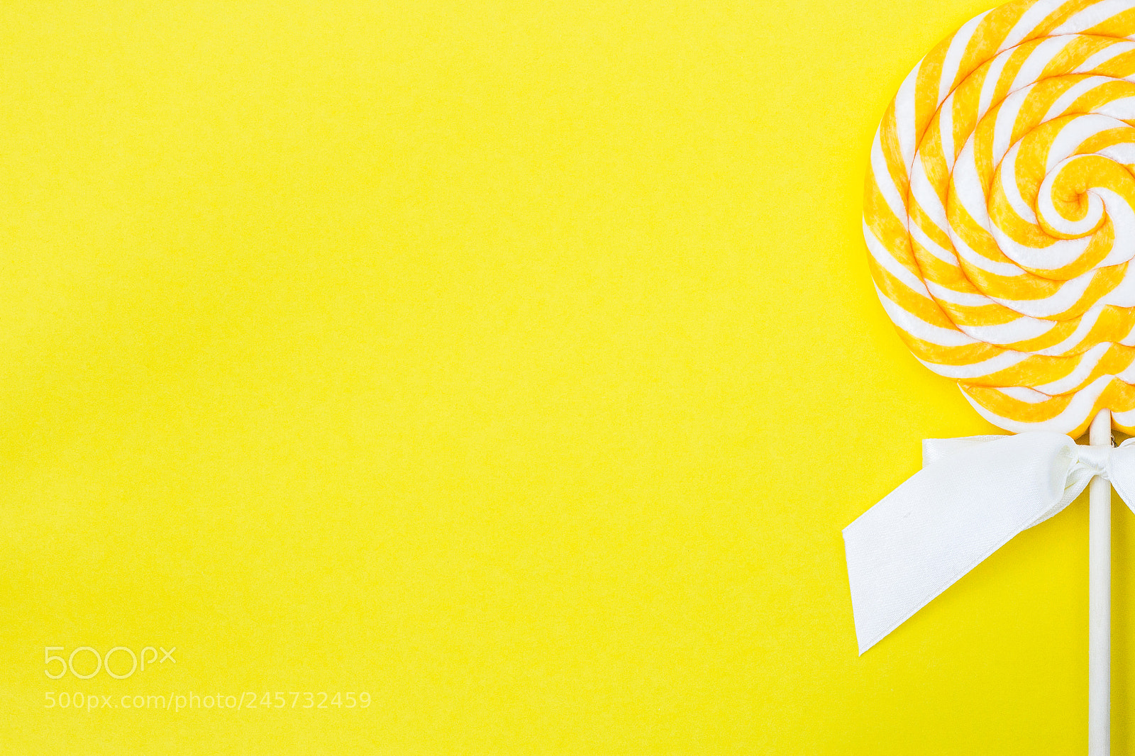 Canon EOS 600D (Rebel EOS T3i / EOS Kiss X5) sample photo. Lollopop on bright yellow photography