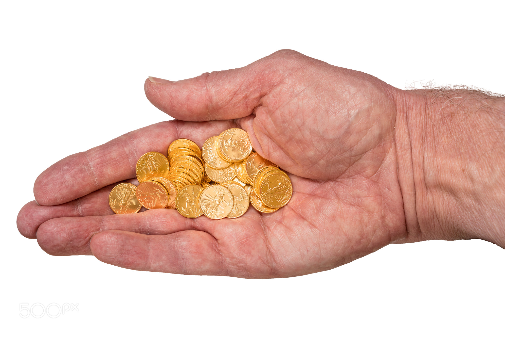 Pure gold tenth ounce coins in senior man hand