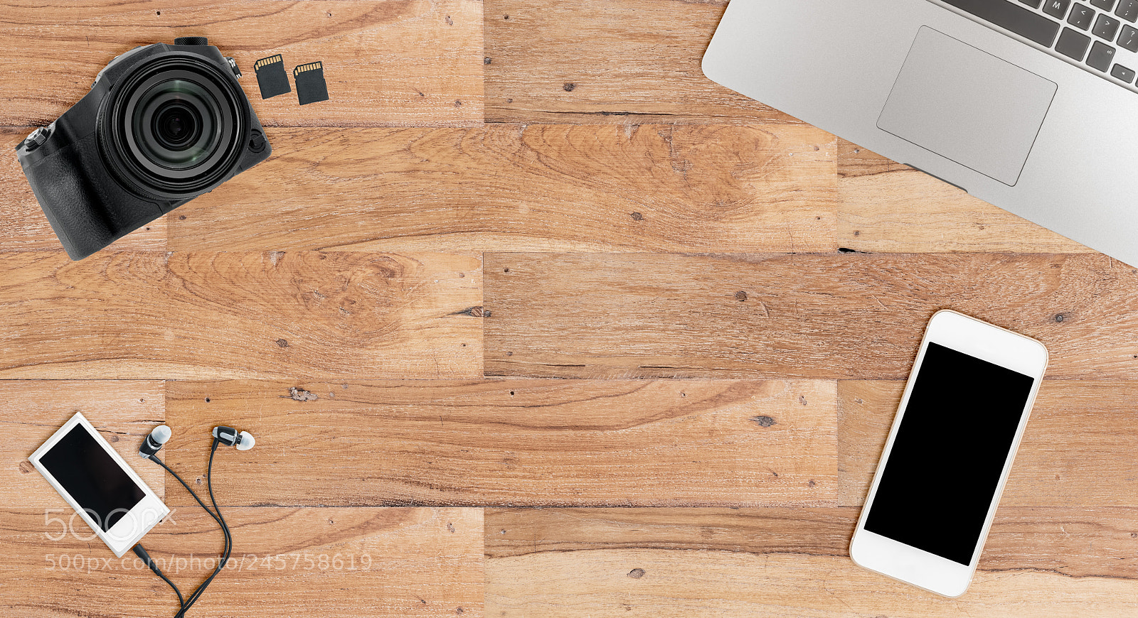 Sony a7R II sample photo. Clean wooden desk with photography