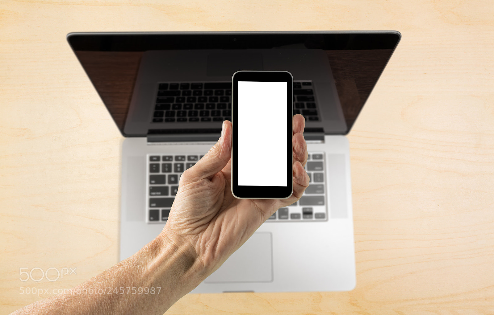 Sony a7R II sample photo. Hand holding smartphone with photography