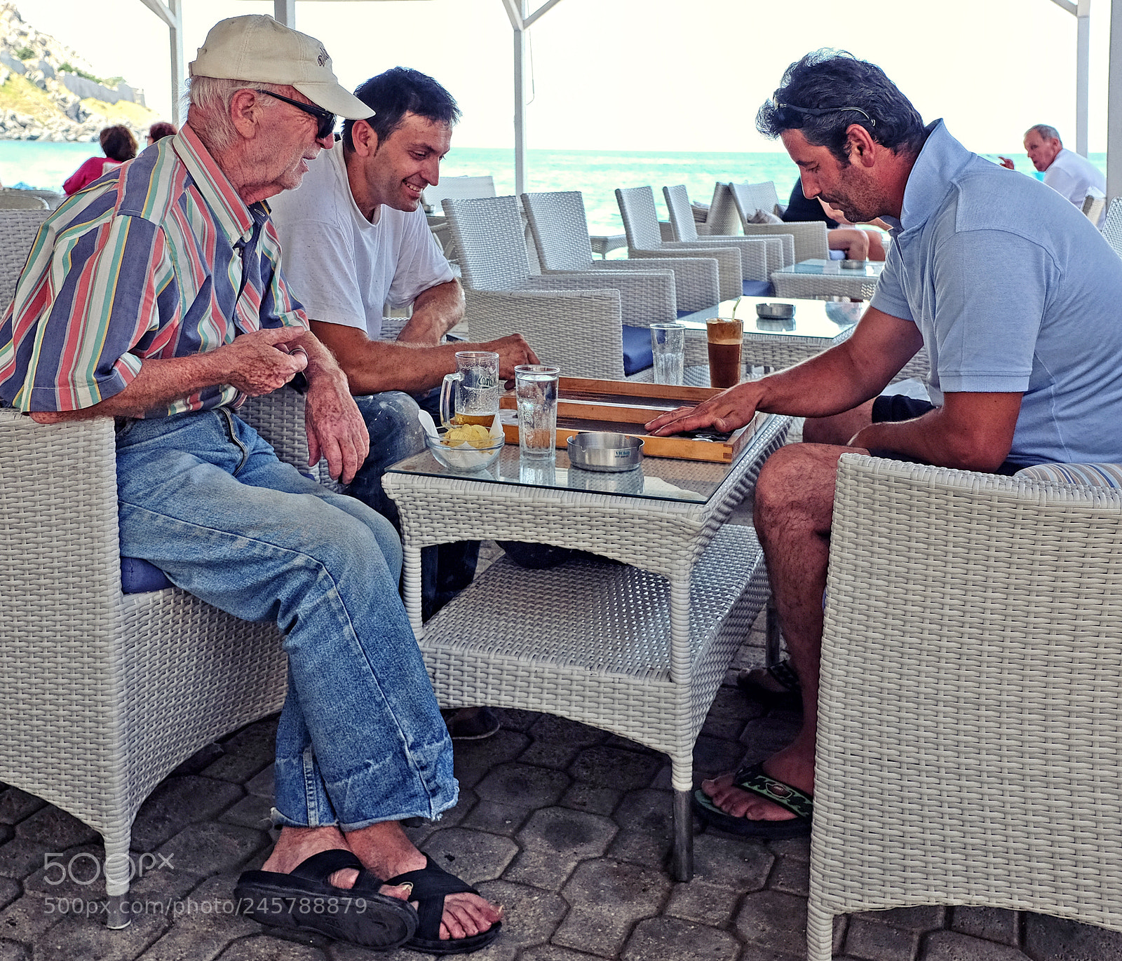 Fujifilm X70 sample photo. Playing backgammon blue waves photography