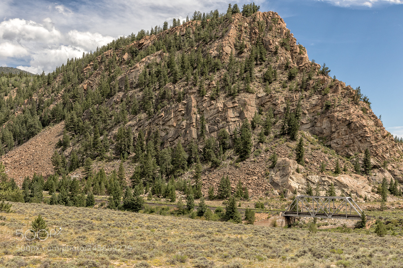 Canon EOS 7D Mark II sample photo. Mountain dwarfing railroad bridge photography