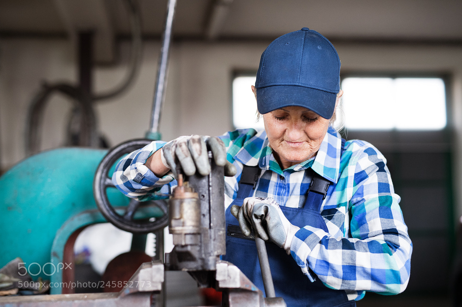 Nikon D5 sample photo. Senior female mechanic repairing photography