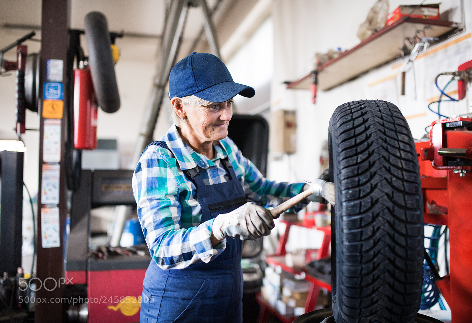 Nikon D5 sample photo. Senior female mechanic repairing photography