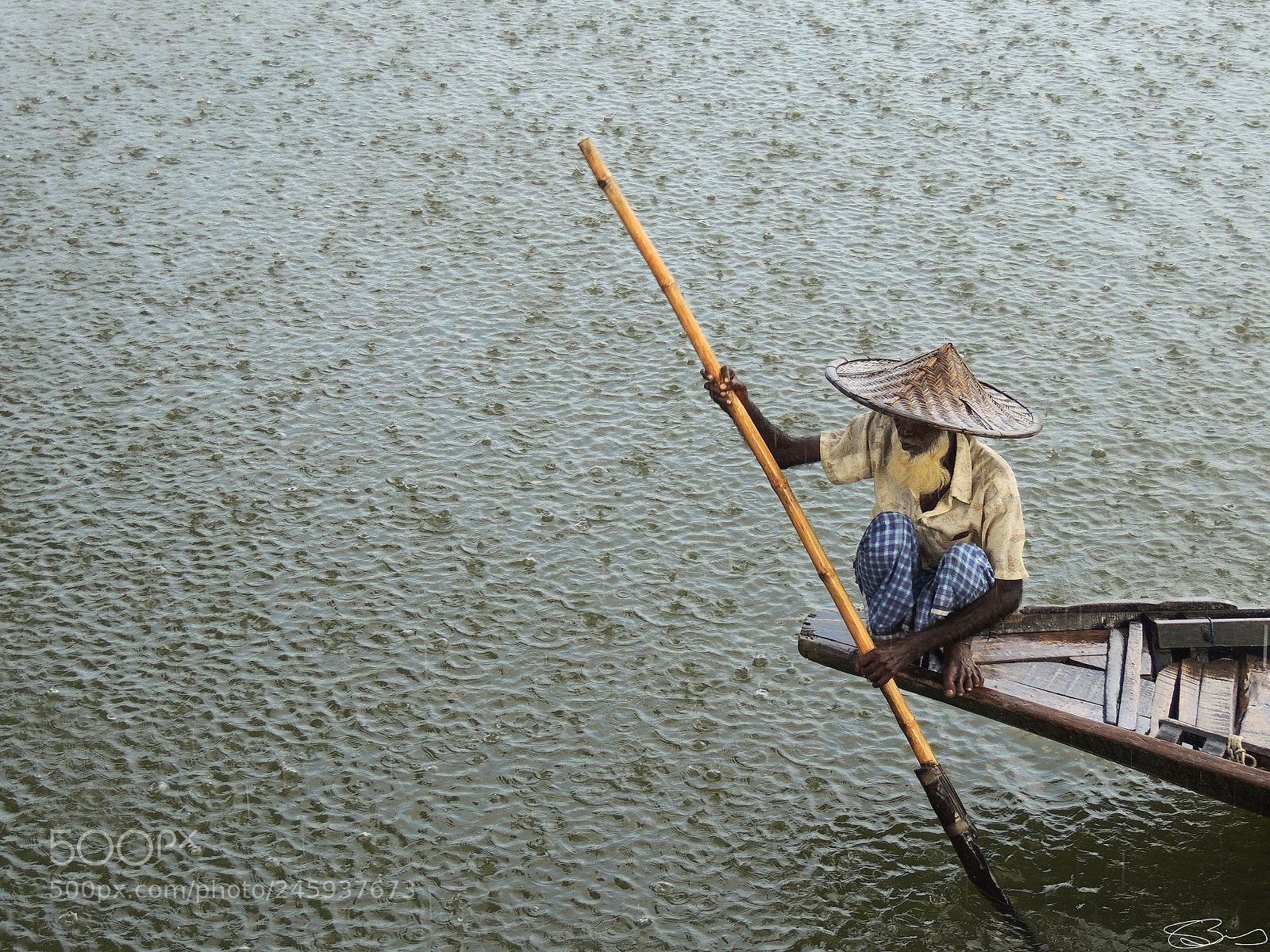 Nikon Coolpix P510 sample photo. Boatman in rain photography