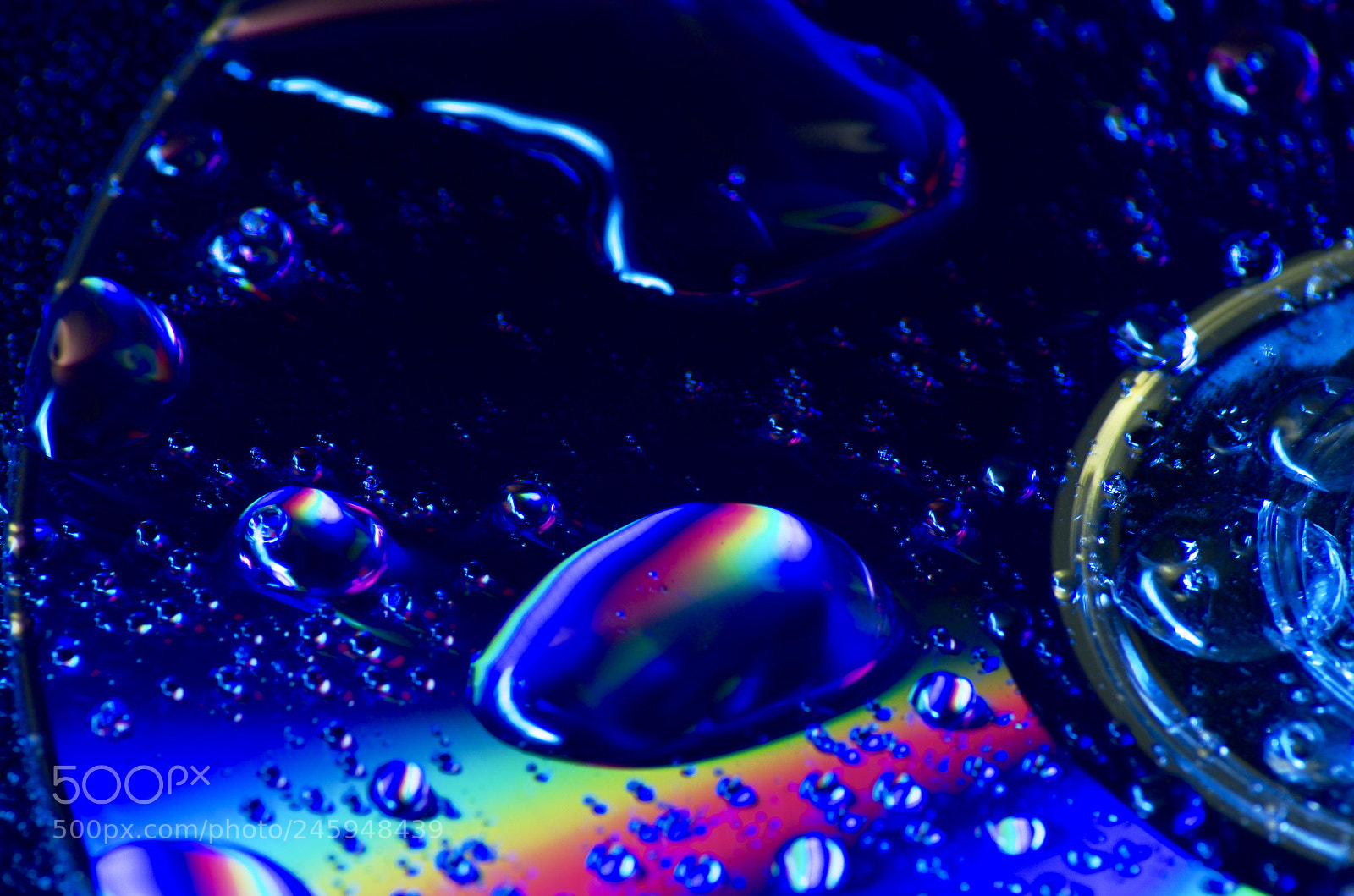 Pentax K-50 sample photo. Waterdrops on cd photography