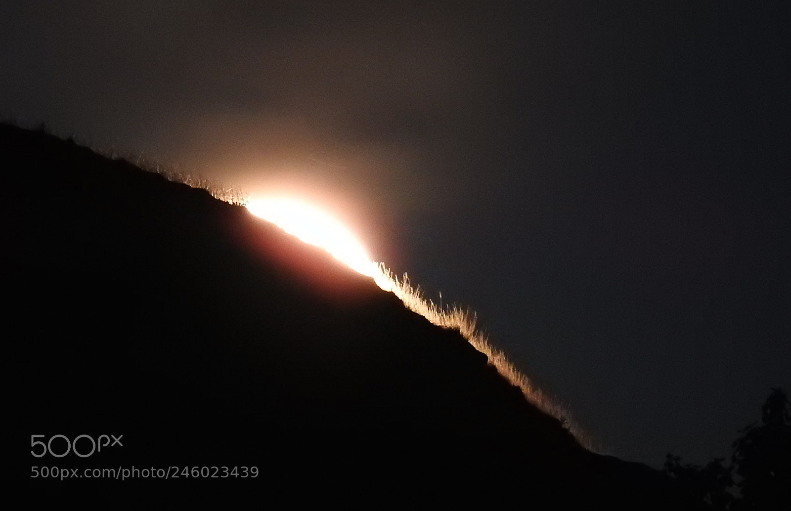 Nikon Coolpix P900 sample photo. Moon rising behind hill photography