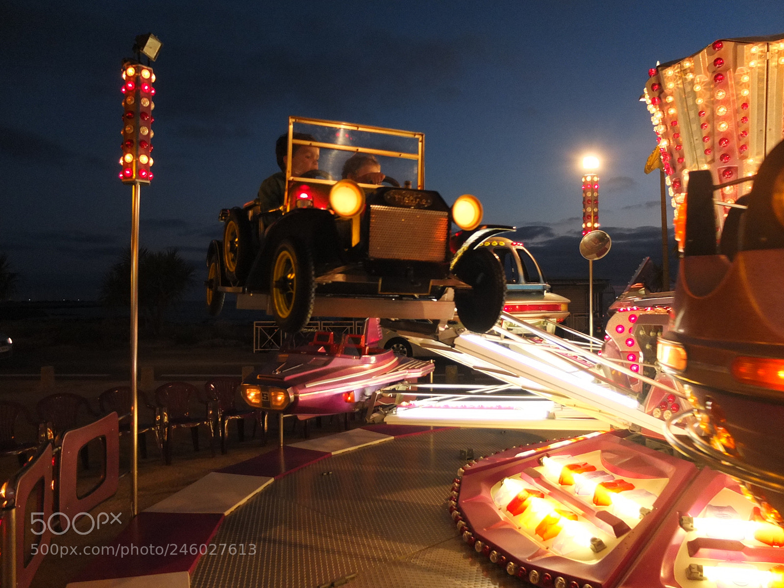 Fujifilm X10 sample photo. Fun fair by night photography