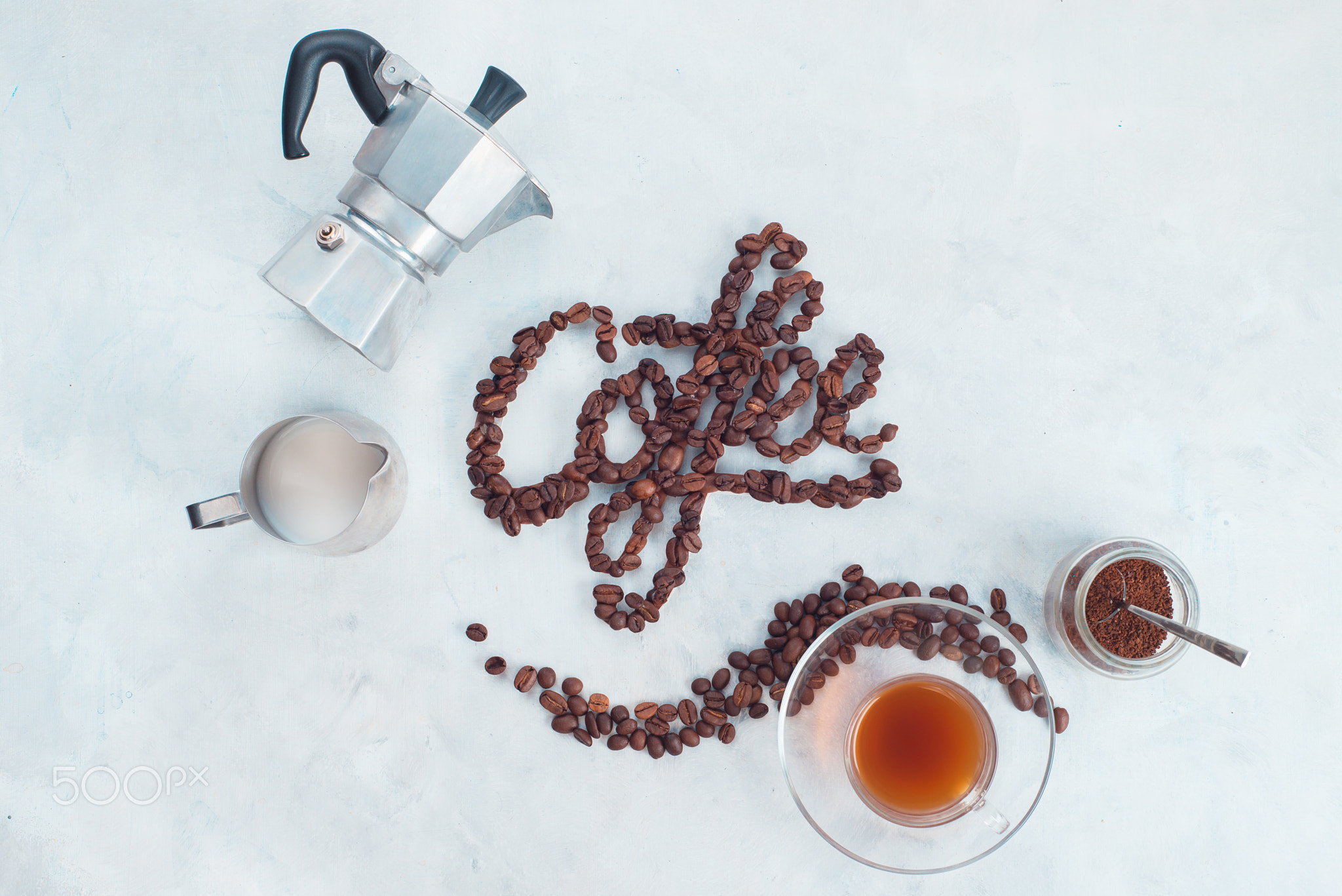 Food lettering concept. Word Coffee made with coffee beans. High key drink photography from...