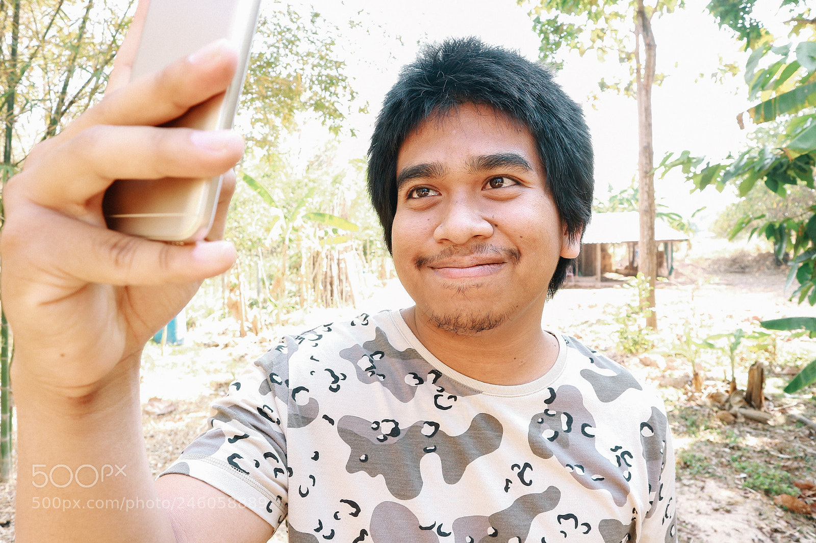 Canon EOS M10 sample photo. Brown skin soldier smile photography