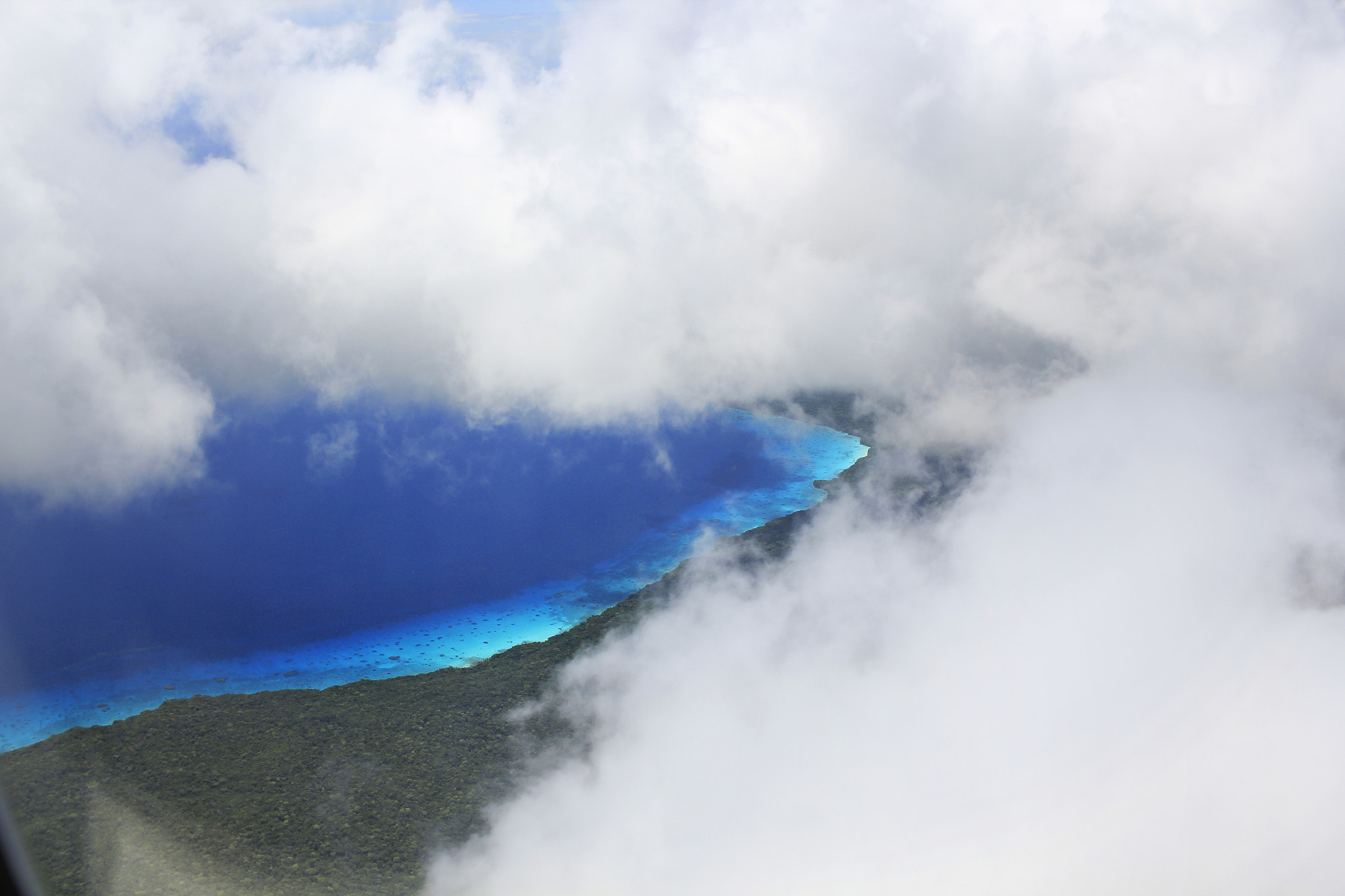 Canon EF-S 24mm F2.8 STM sample photo. Between clouds photography
