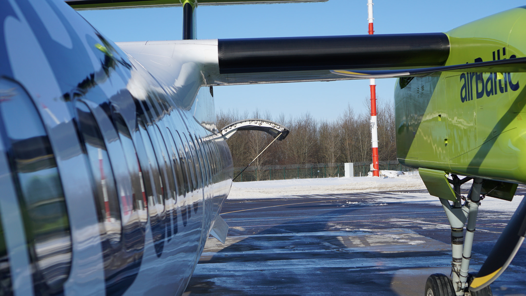 Sony a6000 + Sony E 35mm F1.8 OSS sample photo. Airbaltic bombardier plane photography