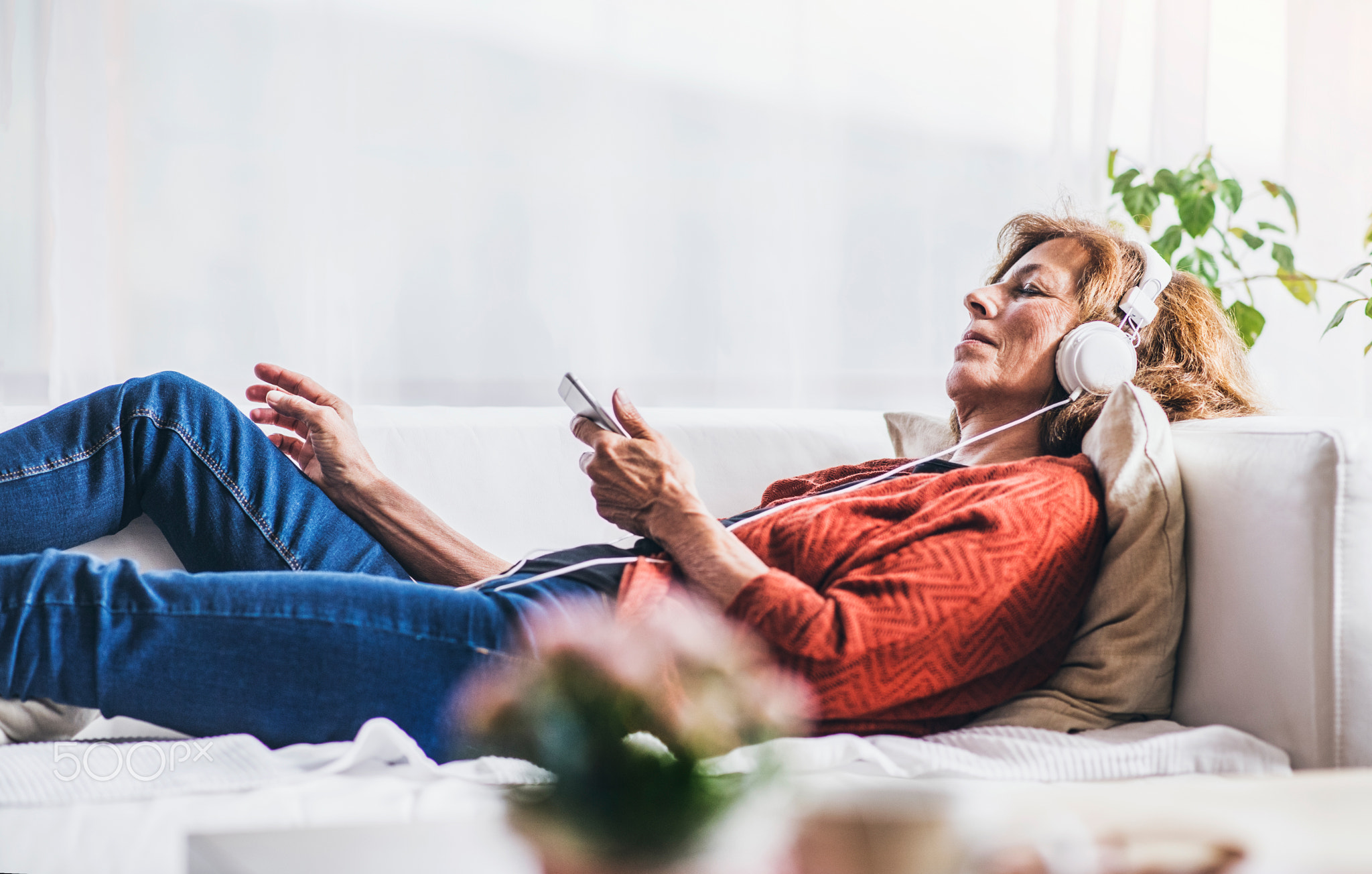 Senior woman relaxing at home.