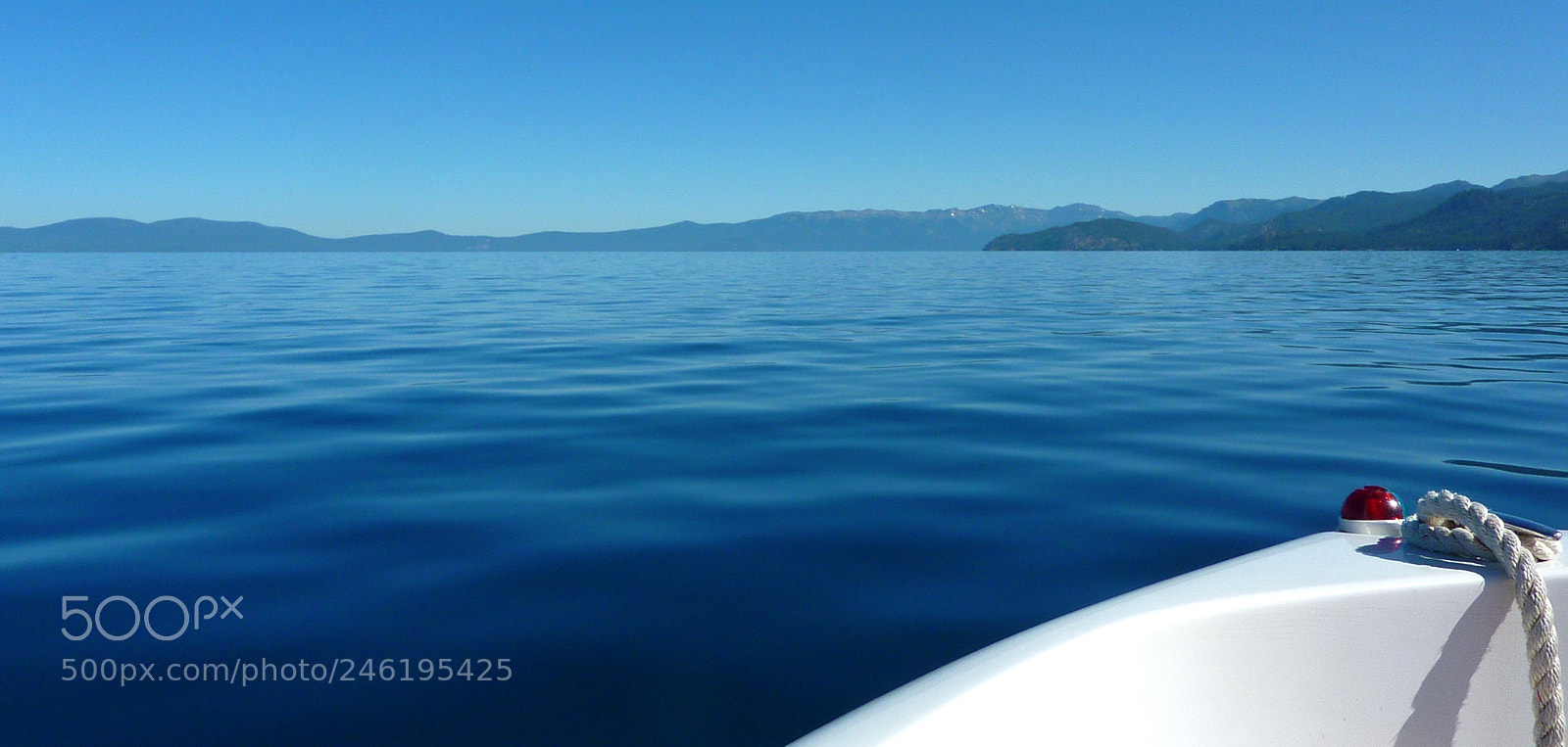 Panasonic DMC-TZ7 sample photo. White boat, blue lake photography