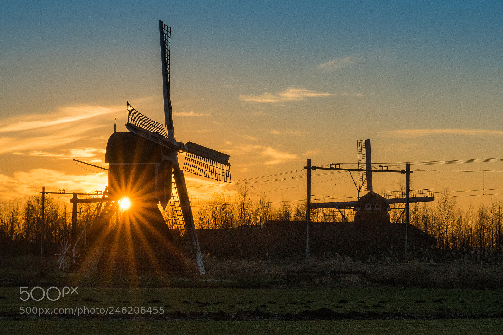 Sony ILCA-77M2 sample photo. Sunset with two windmills photography