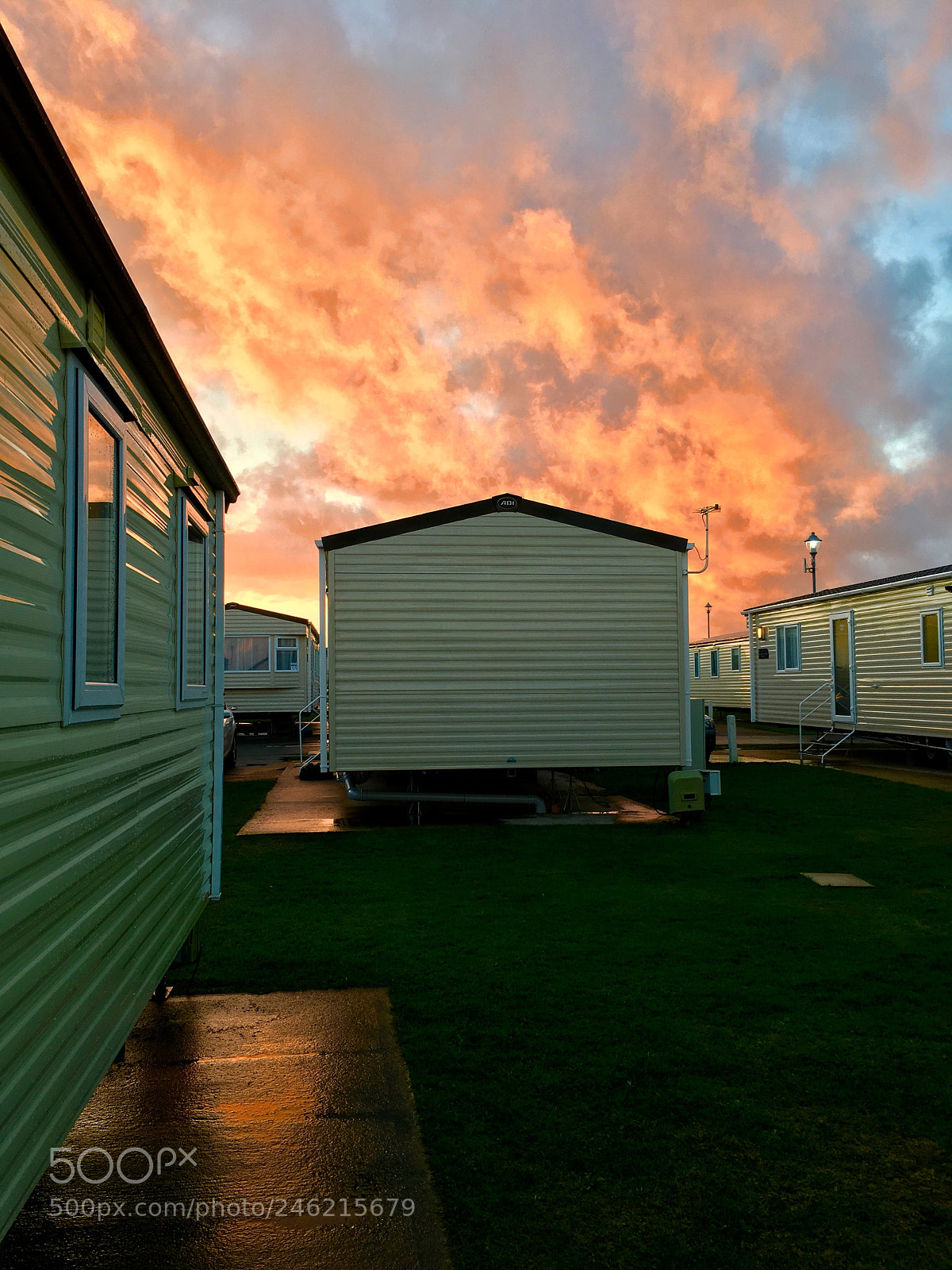 Apple iPhone 6s Plus sample photo. Caravan park..orange sky s photography