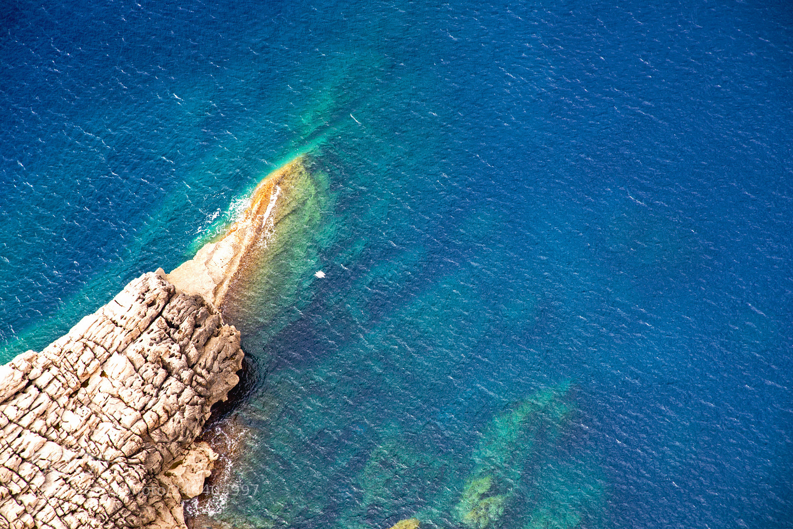 Nikon D610 sample photo. Rocks vs sea photography