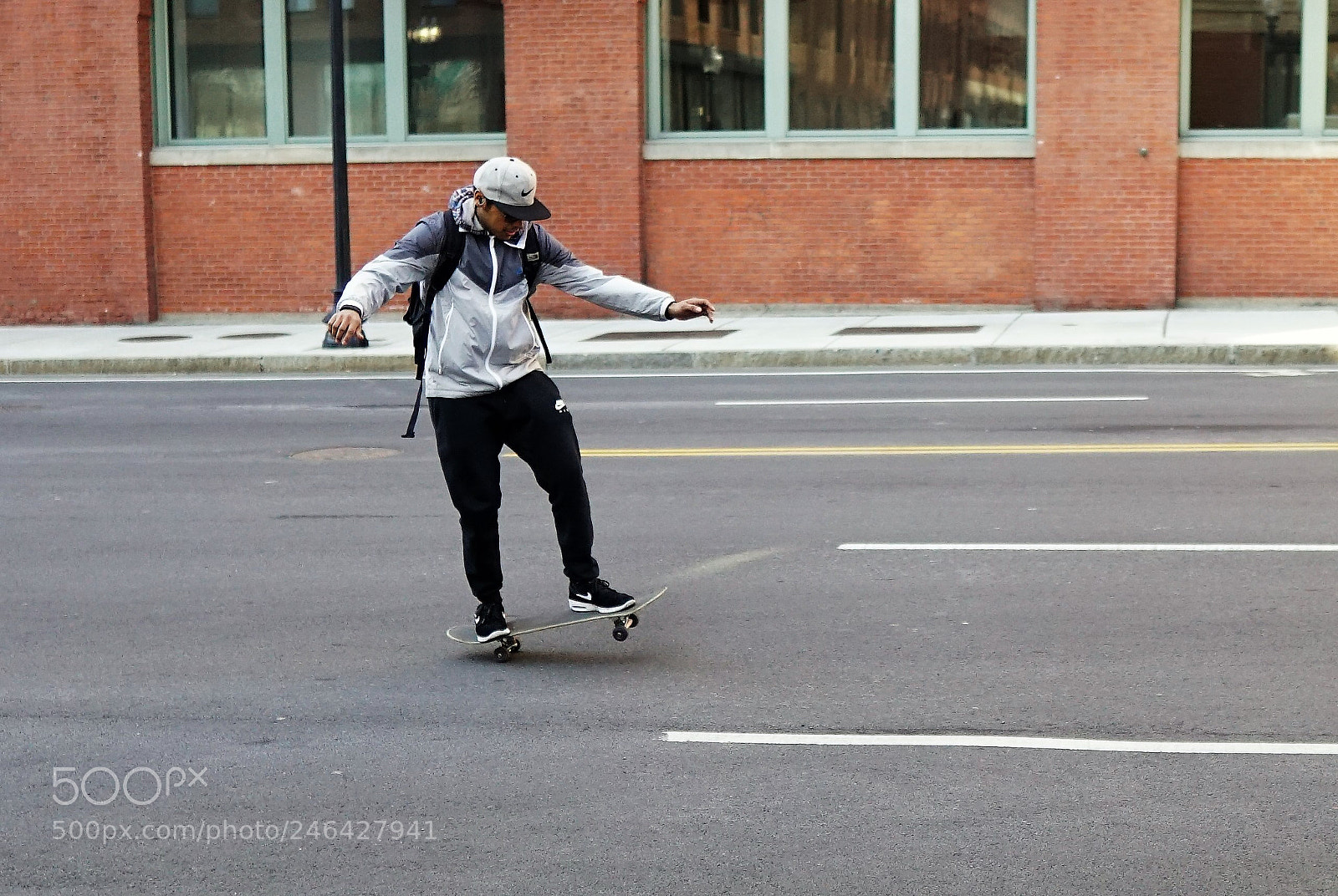 Sony a6500 sample photo. Skateboarding on busy causeway photography