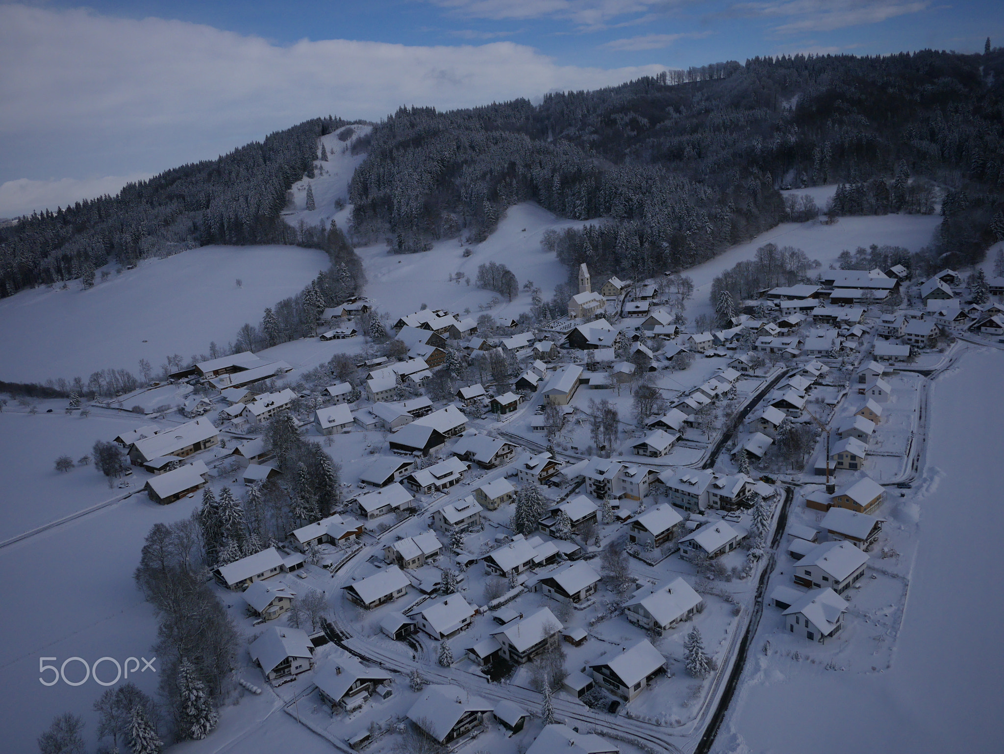 aerial photo of village in winter