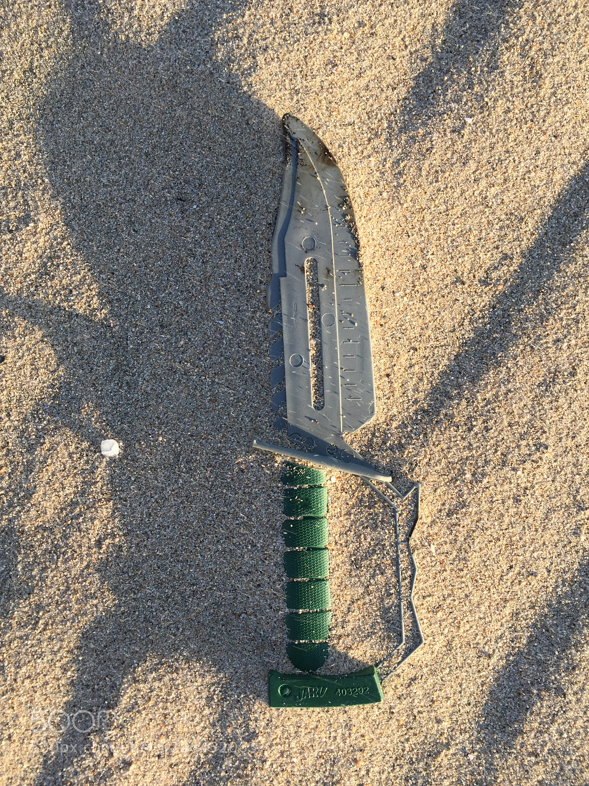 Apple iPhone 6 Plus sample photo. Knife in sand photography