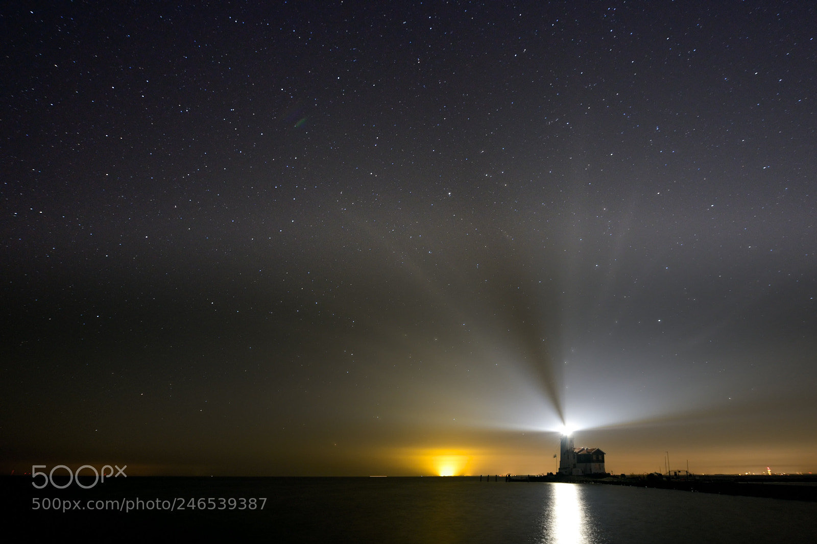 Nikon D850 sample photo. Stars above lighthouse marken photography