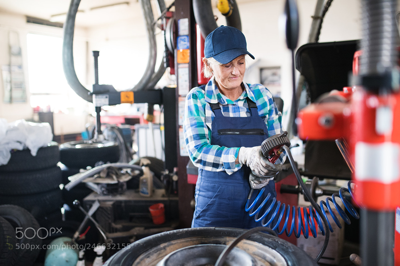 Nikon D5 sample photo. Senior female mechanic repairing photography