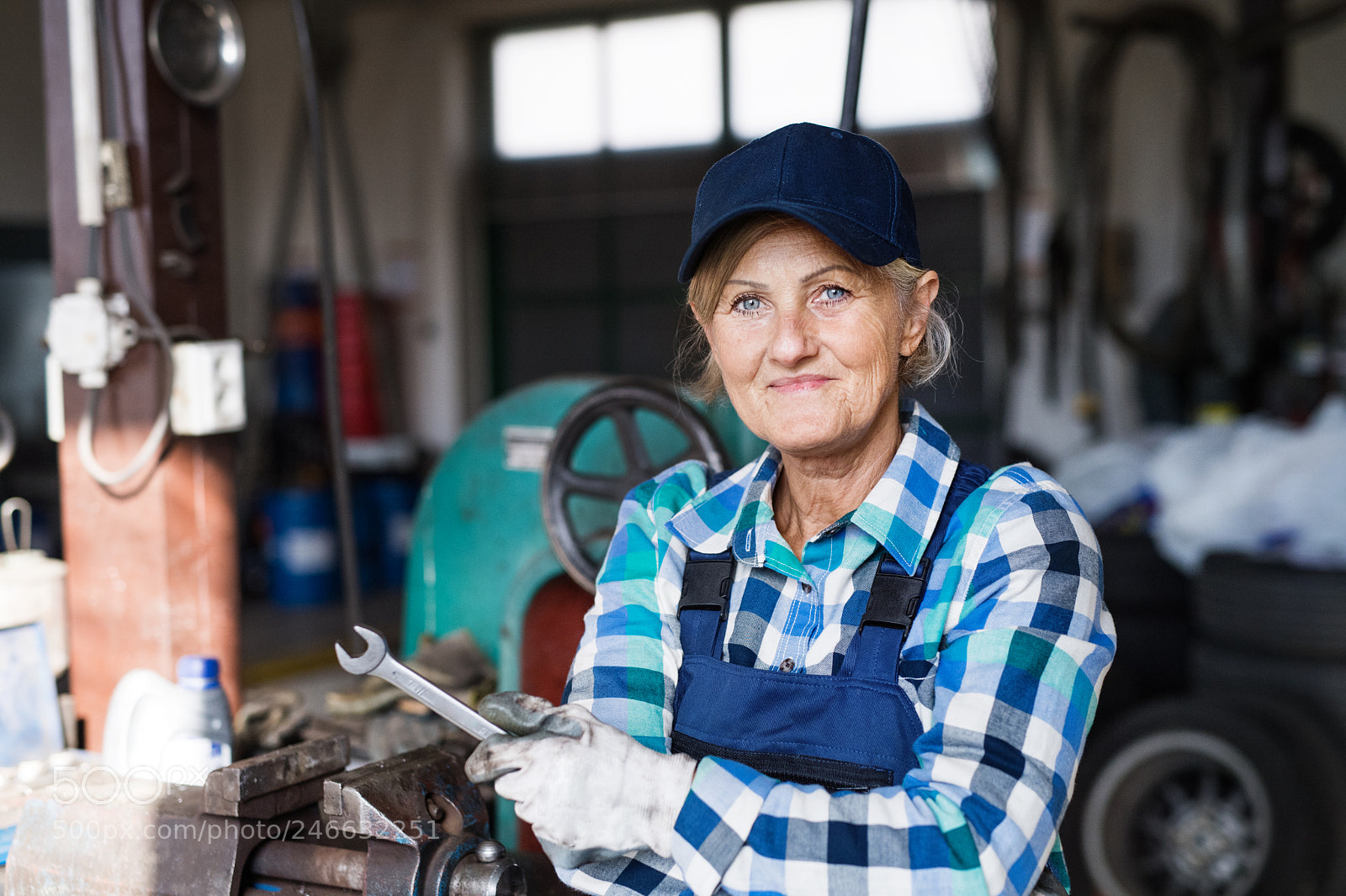 Nikon D5 sample photo. Senior female mechanic repairing photography