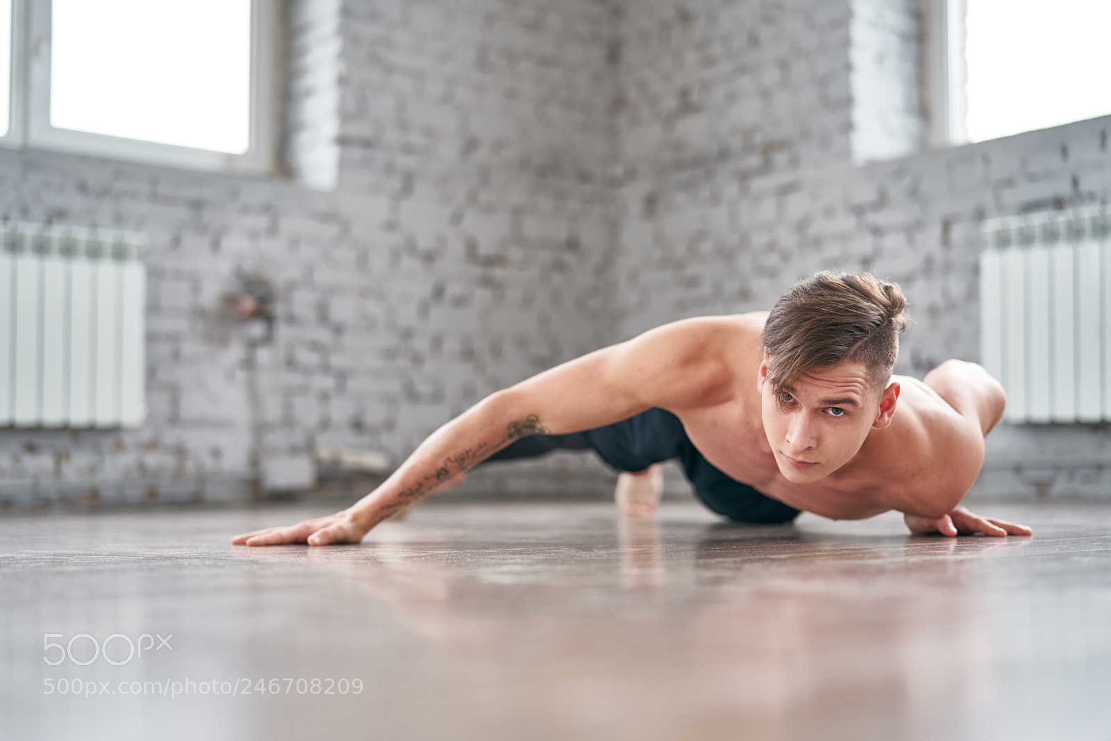 Sony a9 sample photo. Athletic young man doing photography