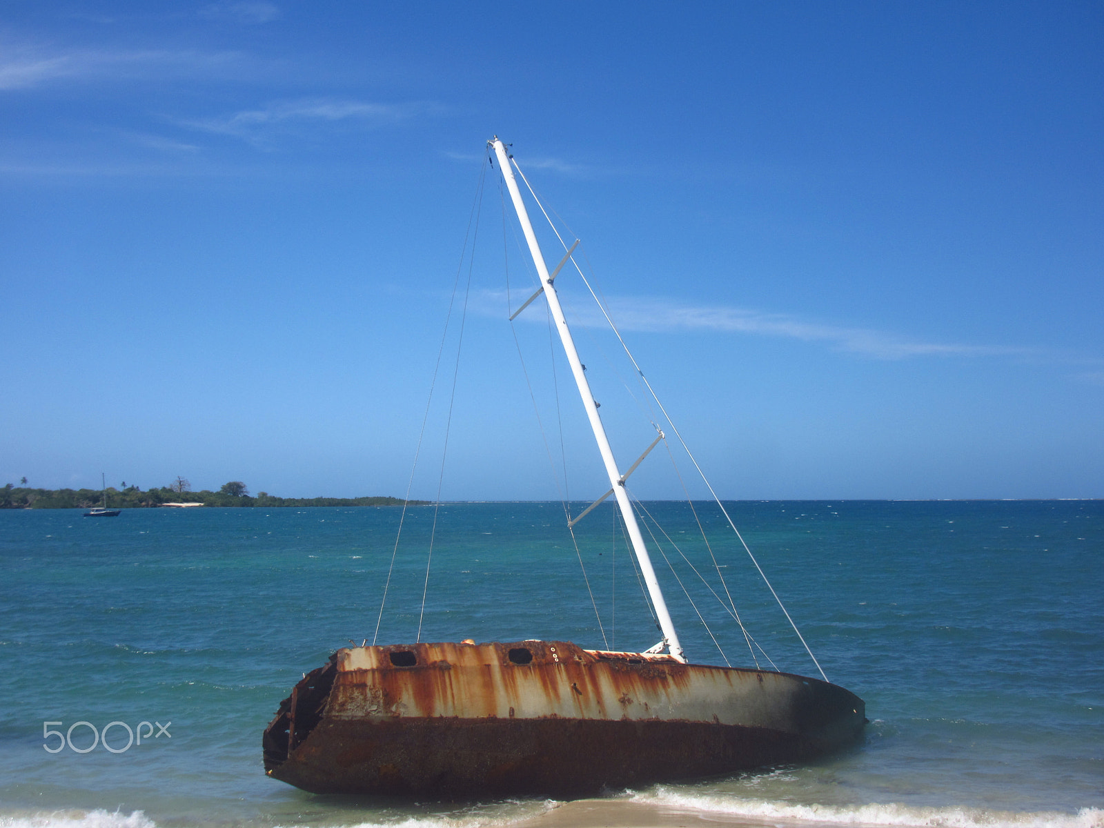 Canon PowerShot SX600 HS sample photo. Beached boat tanzania photography