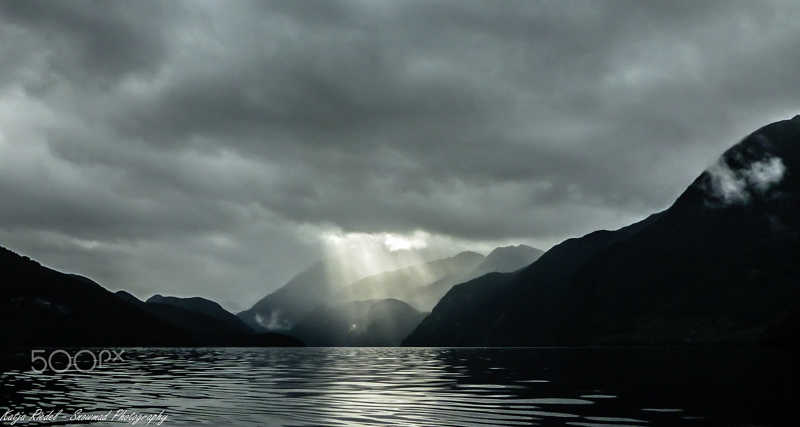 Panasonic DMC-FT4 sample photo. Sun breaks through clouds, fjordland, new zealand photography