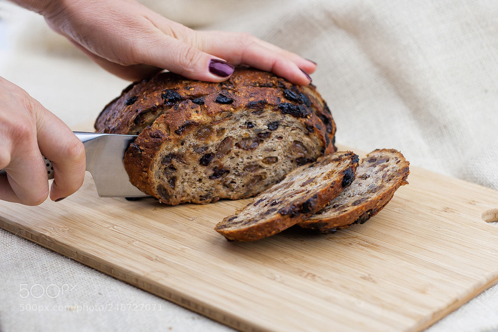 Canon EOS 30D sample photo. Woman cuts fruit bread photography