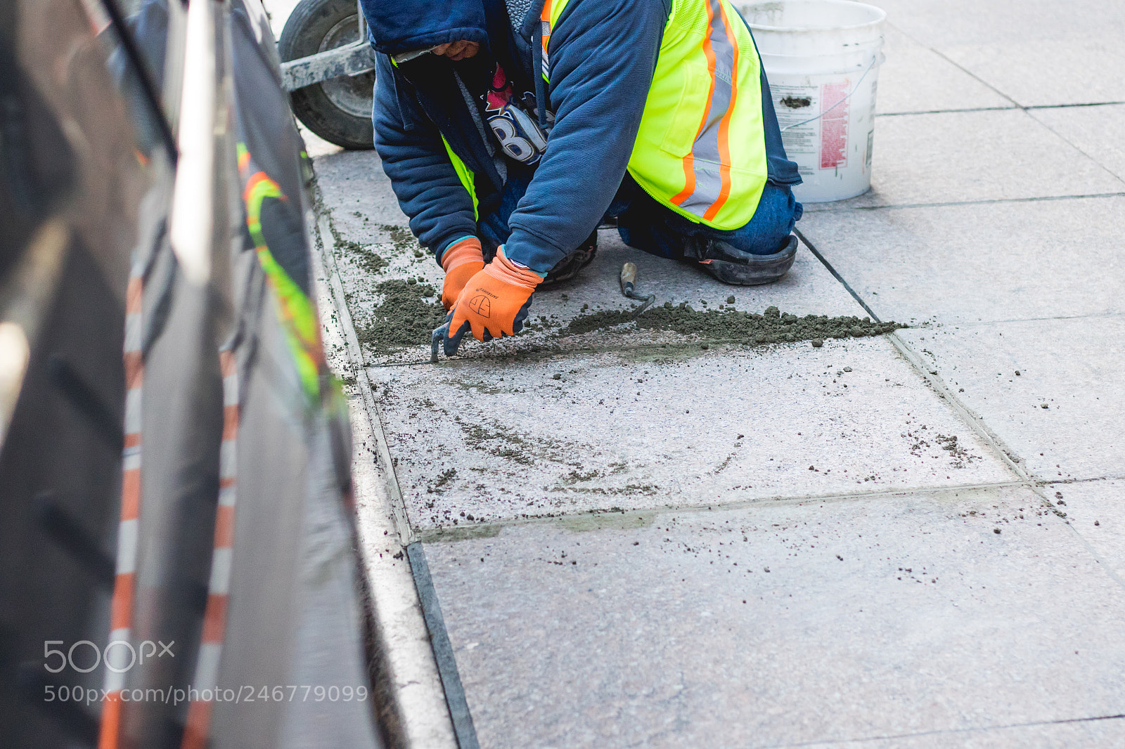 Canon EOS 7D Mark II sample photo. Person fixing the sidewalk photography