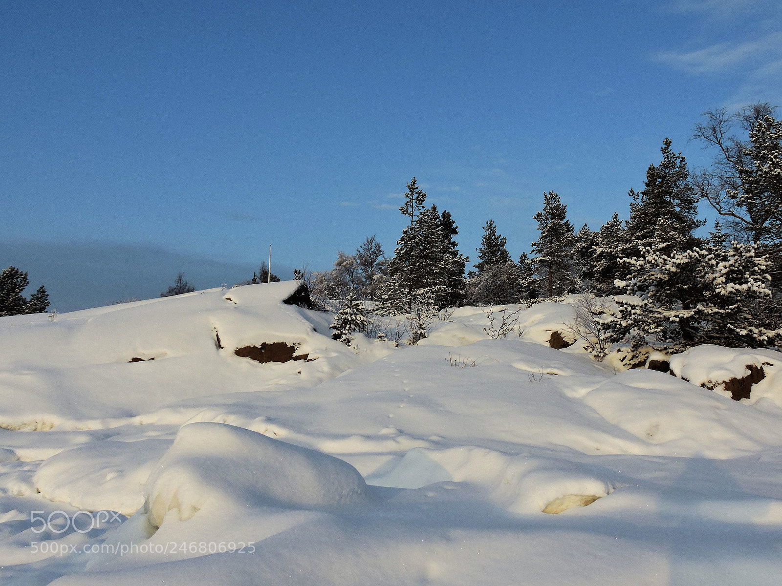 Nikon Coolpix P600 sample photo. Snow-capped rocks against blue photography