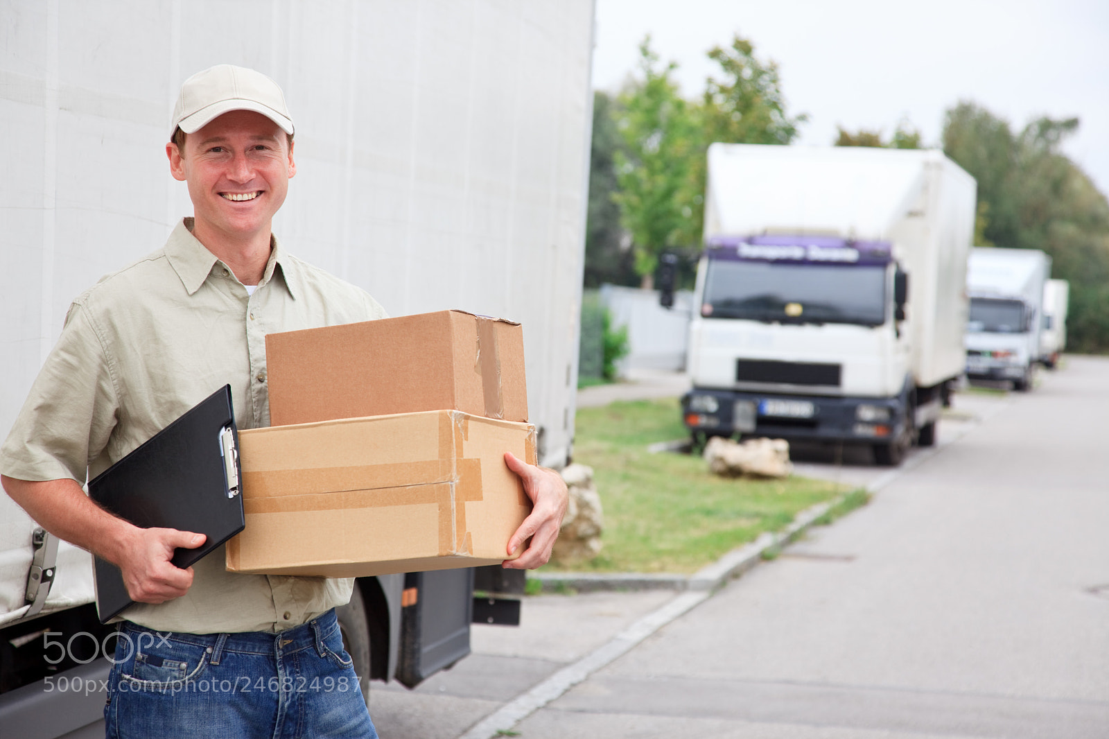 Canon EOS 5D Mark II sample photo. Delivery boy standing next photography