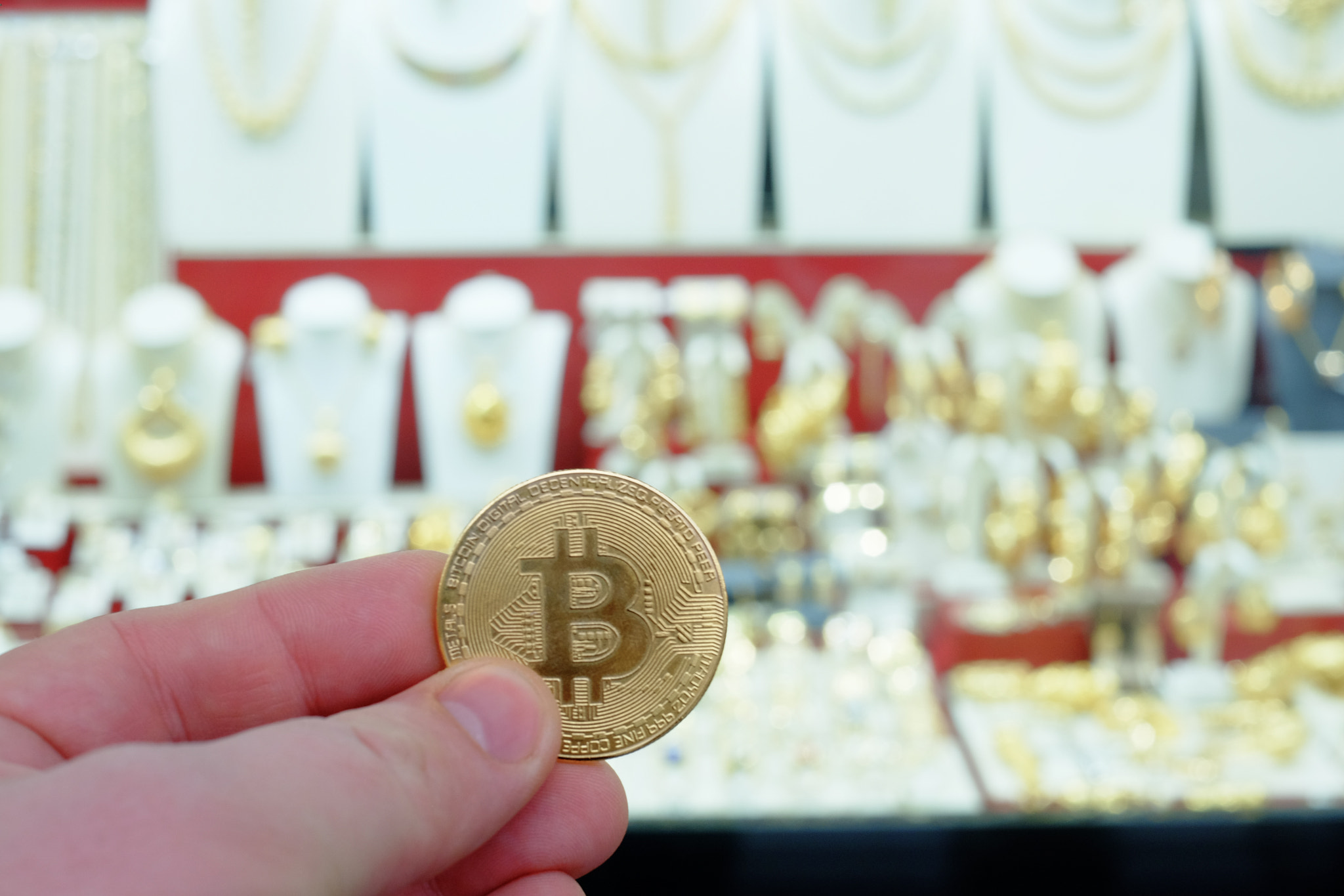 Bitcoin payment for jewelry at a shop using cryptocurrency in re