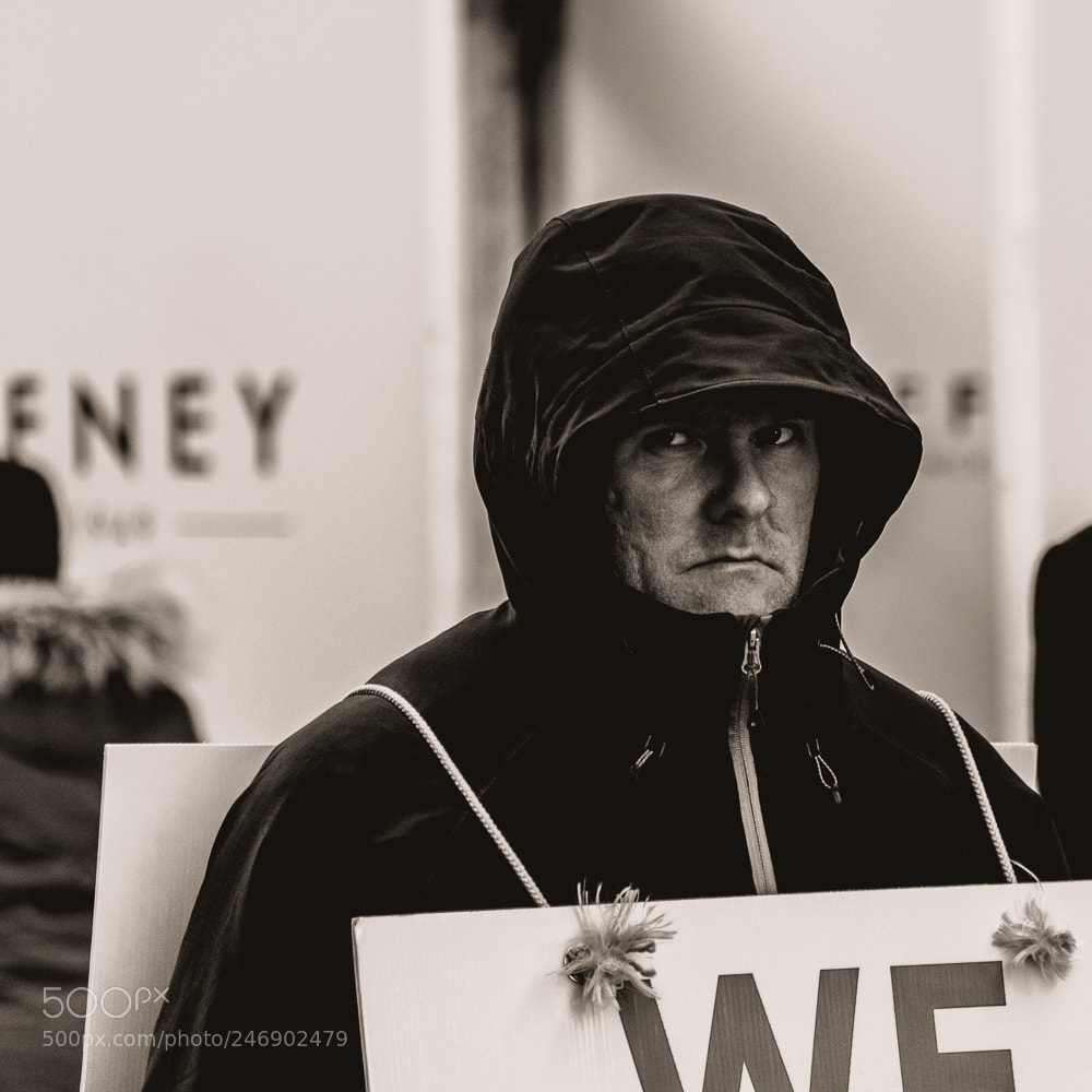 Nikon D5600 sample photo. Man with sign photography