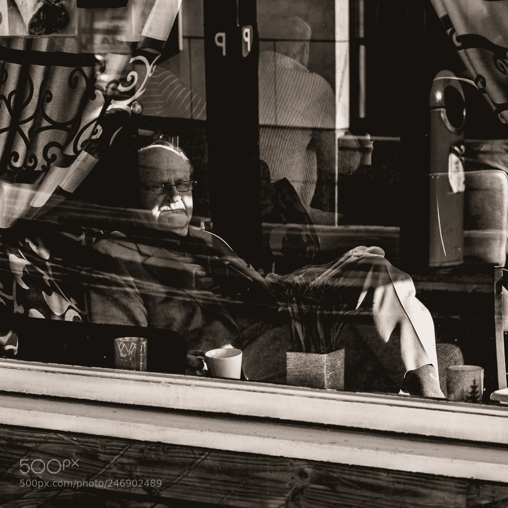 Nikon D5600 sample photo. Man behind window photography