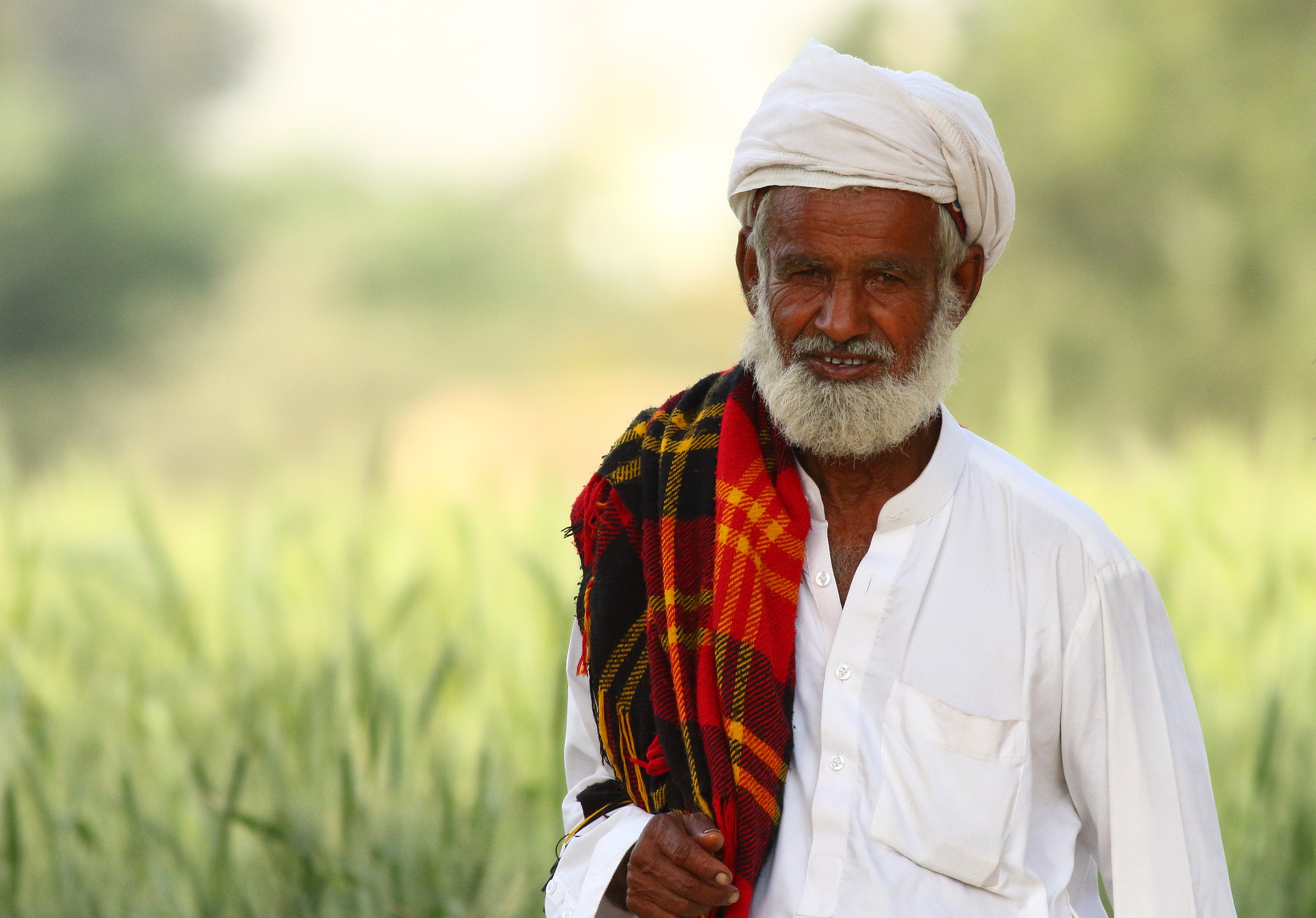 Canon EOS 7D Mark II + Canon EF 400mm F5.6L USM sample photo. An older villager photography