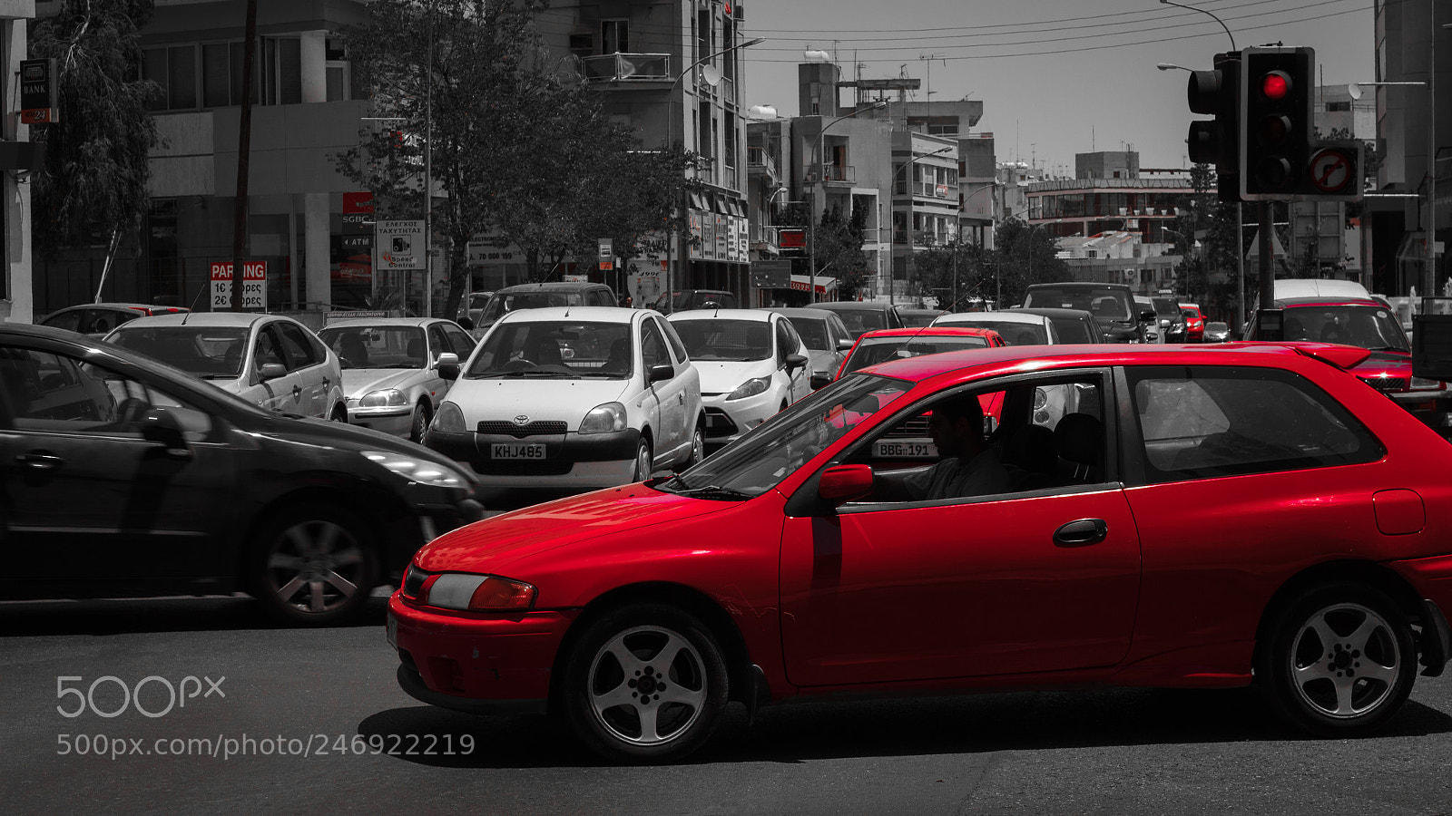 Canon EOS 600D (Rebel EOS T3i / EOS Kiss X5) sample photo. Red car in traffic photography
