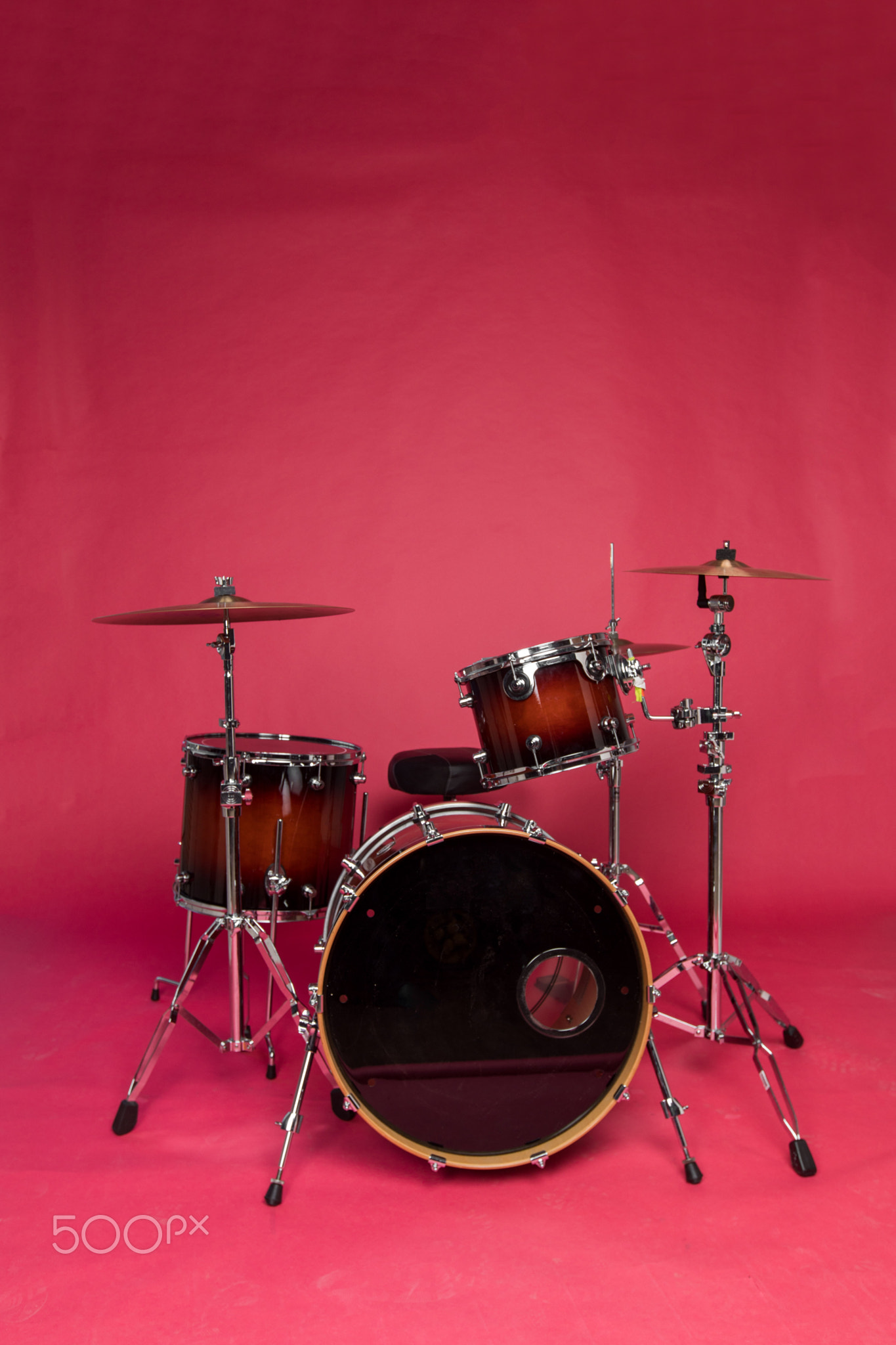 Drum set on a red background