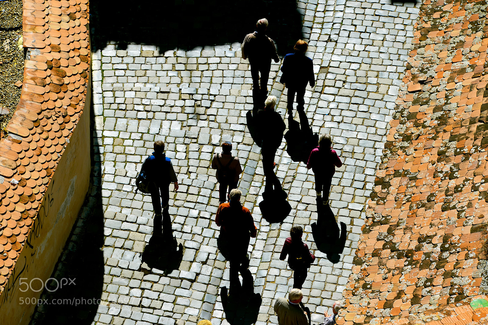 Nikon Df sample photo. People walking by cobblestone photography