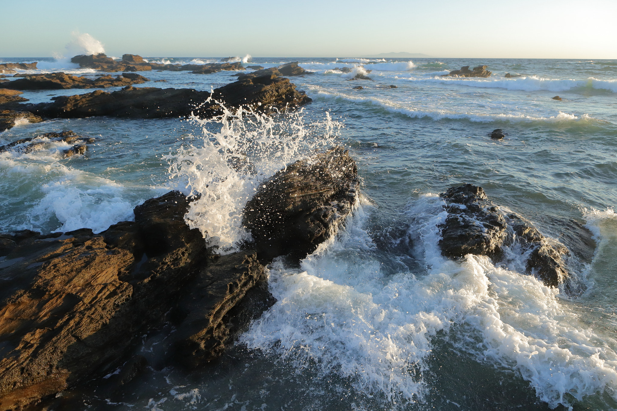 Canon EF 24-70mm F2.8L USM sample photo. A wave breaking on a rock photography