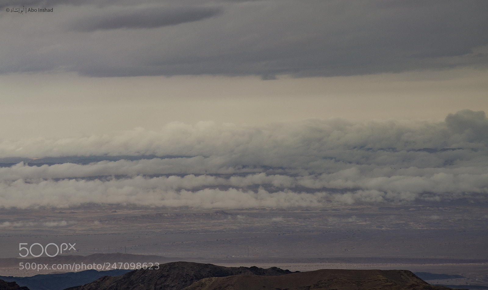 Nikon D3200 sample photo. الغيوم الملامسة لسطح الارض خلف هضاب البتراء photography