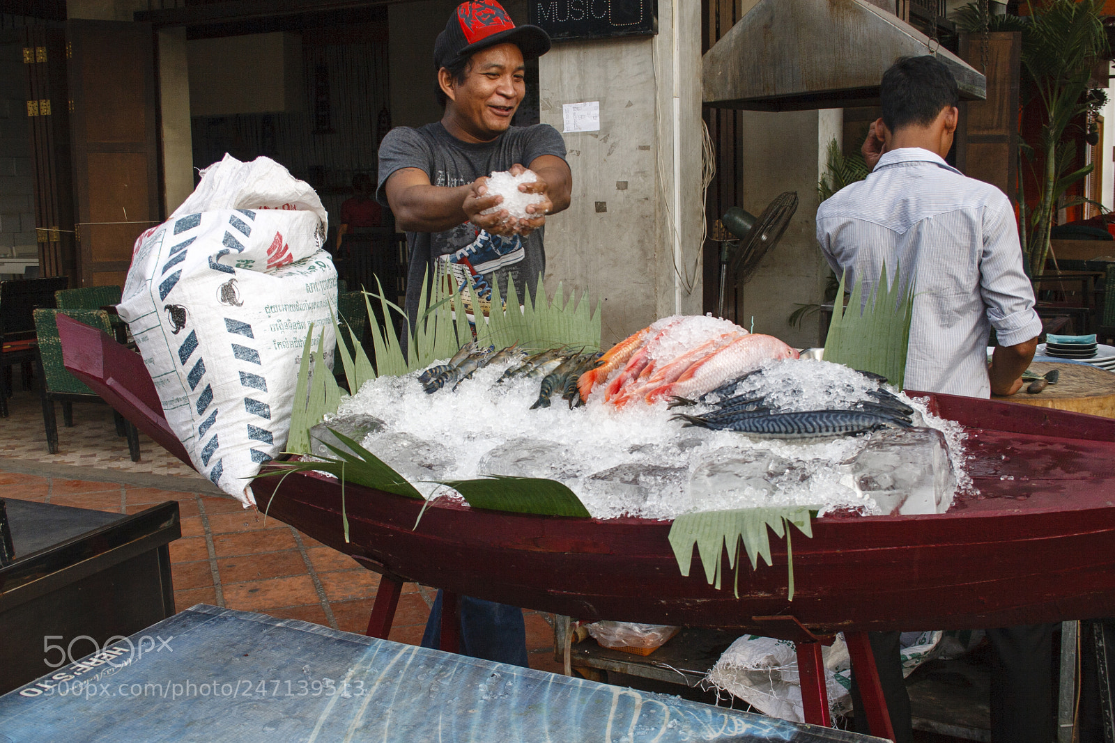 Canon EOS 30D sample photo. Preparing fish showcase photography