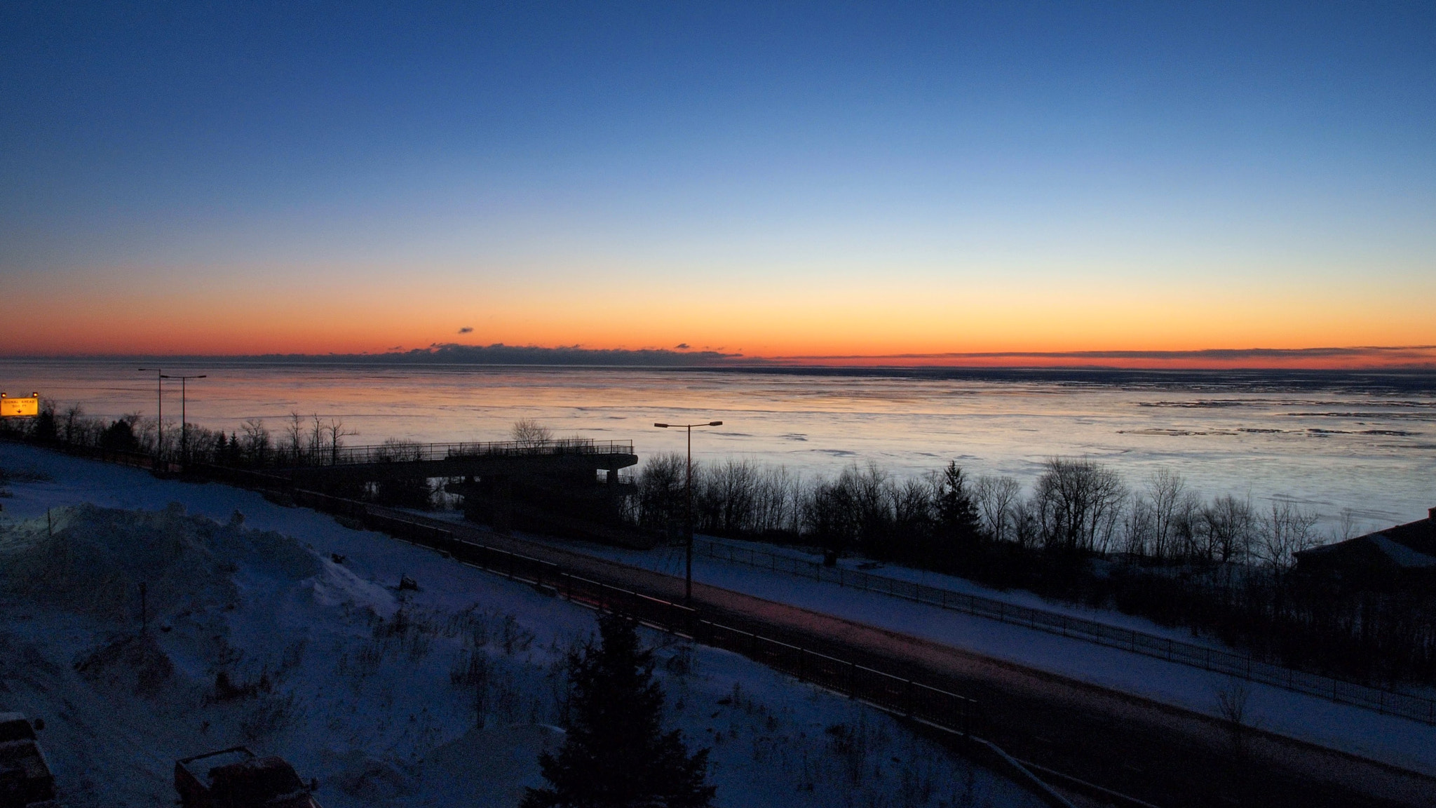 Olympus PEN E-P2 sample photo. Sunrise over lake superior in winter photography