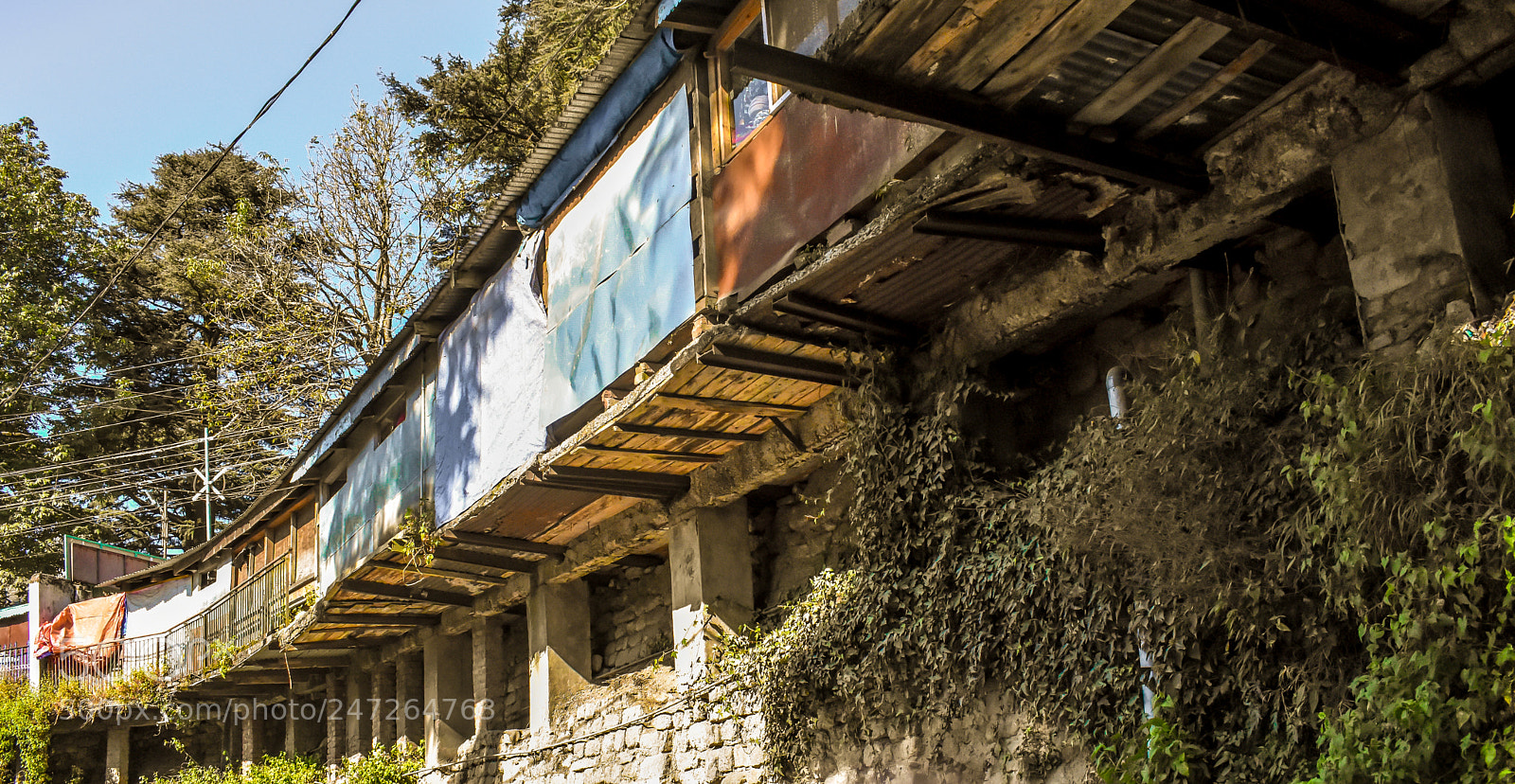 Nikon D3400 sample photo. Homes hanging over roads photography